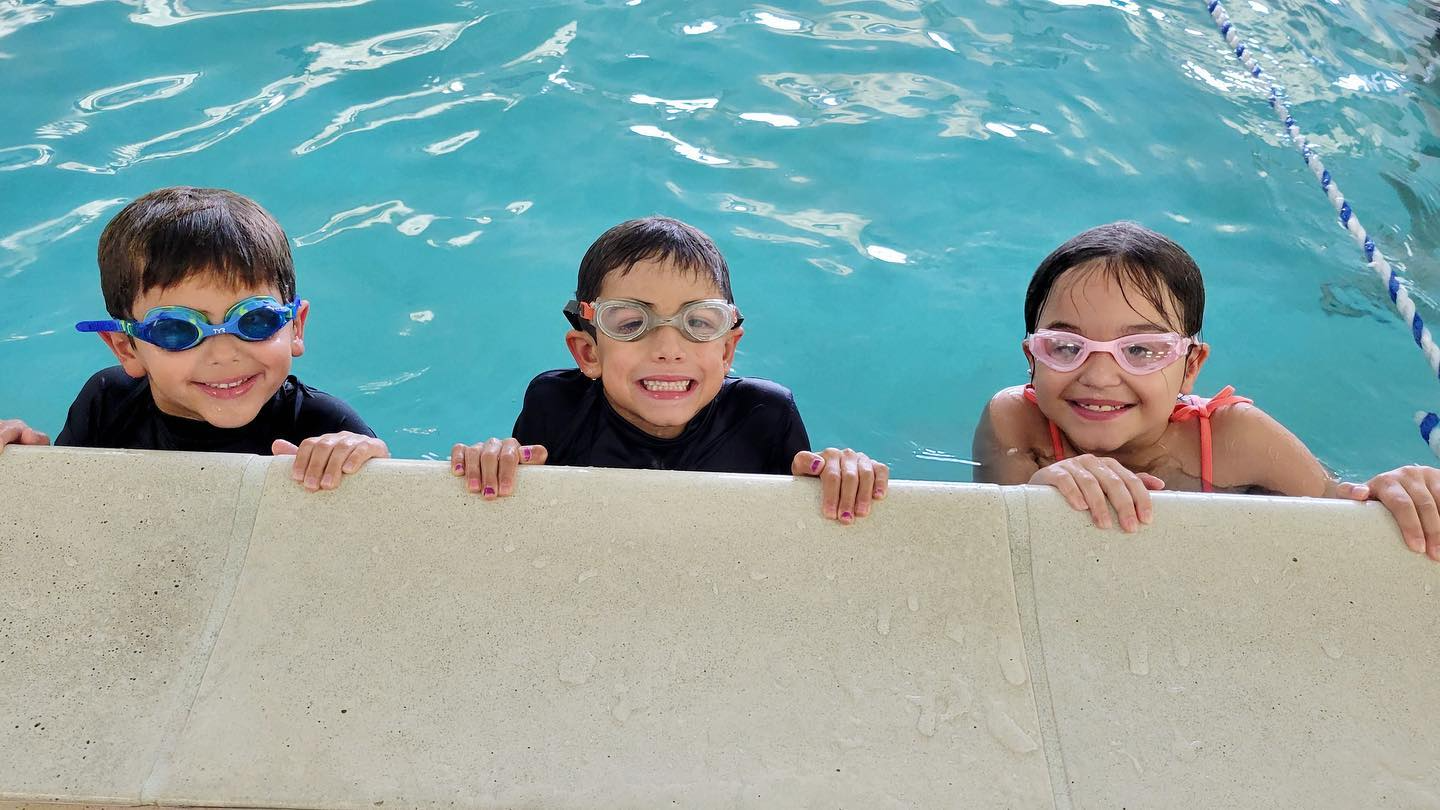 a group of boys in a pool