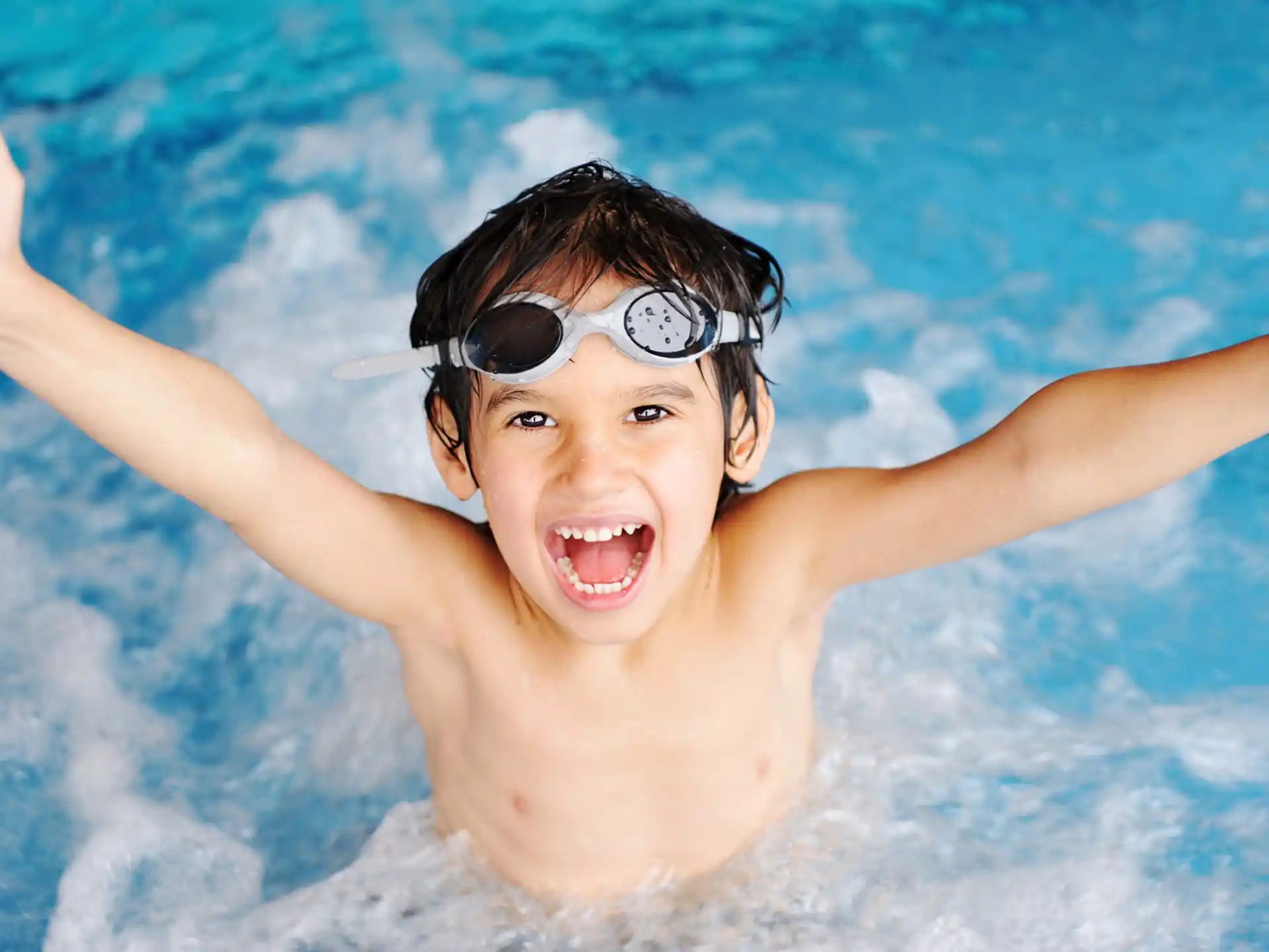 a boy in a pool