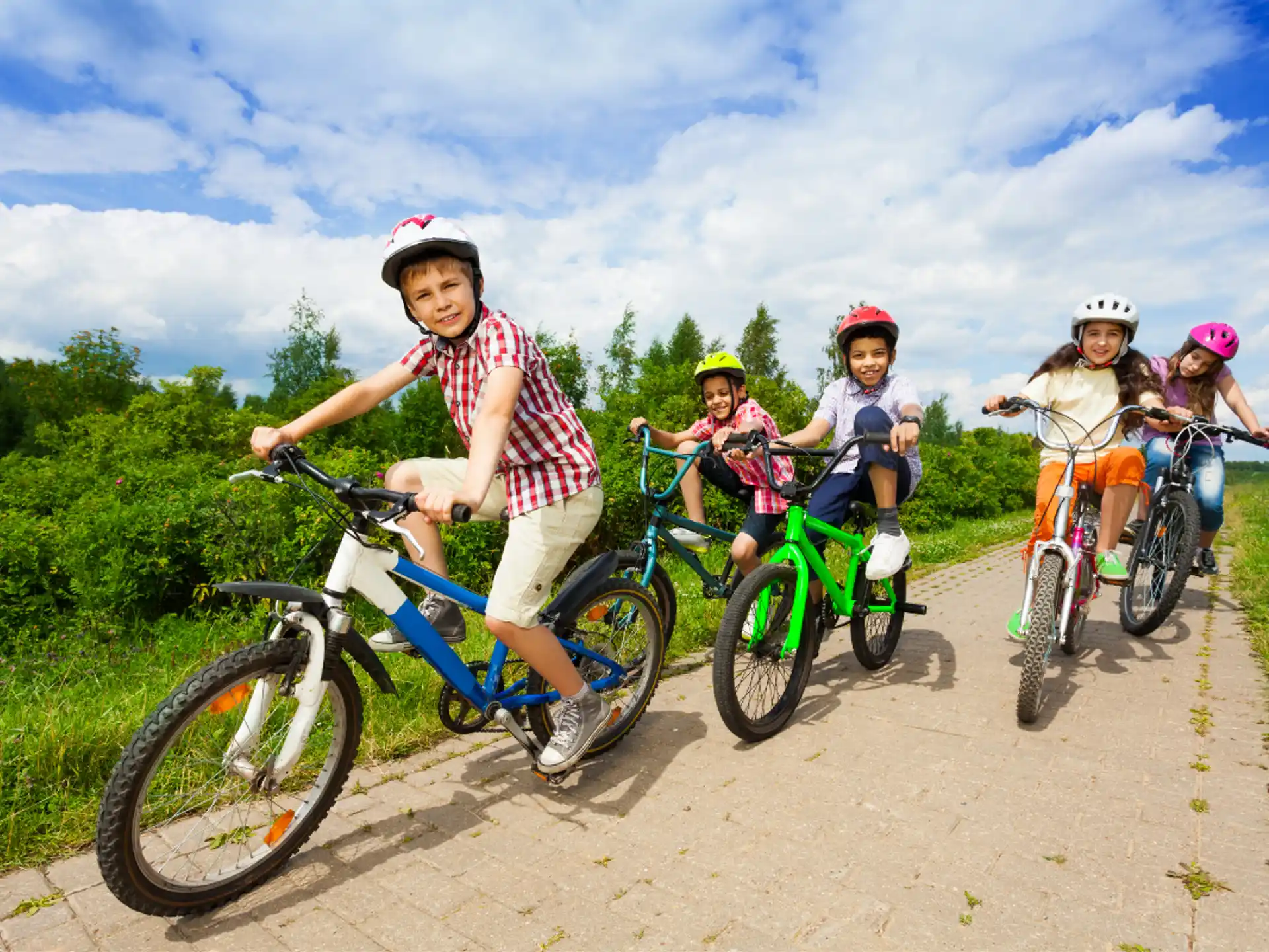 a group of kids riding bikes