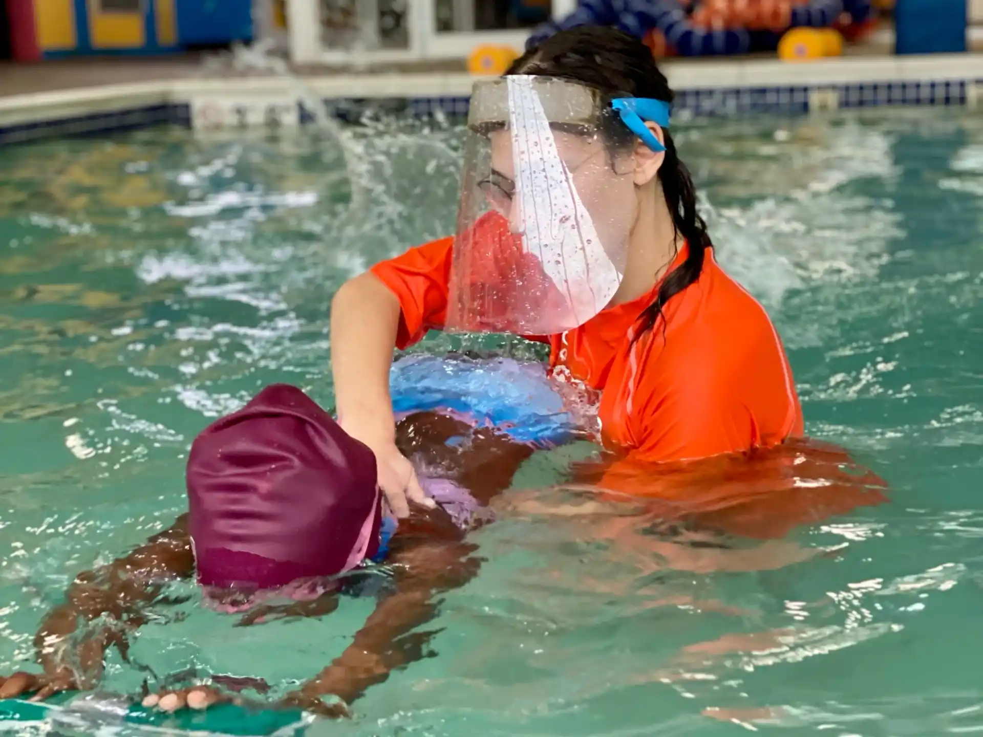 a couple of women in a pool