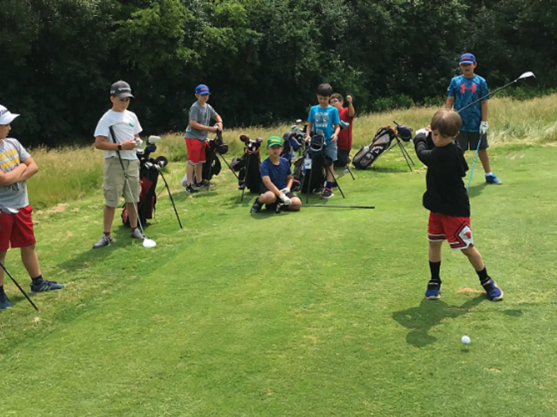 a group of people playing golf