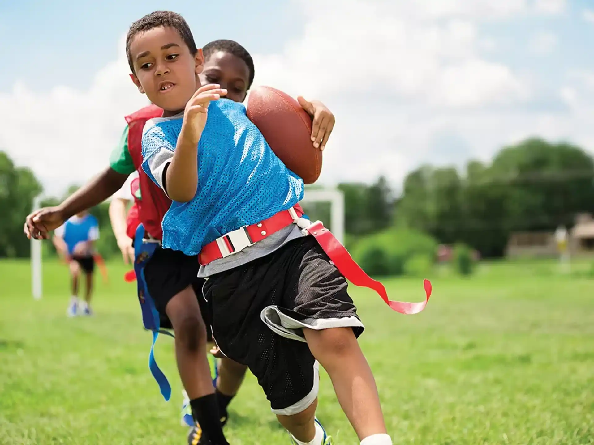 a group of boys playing football