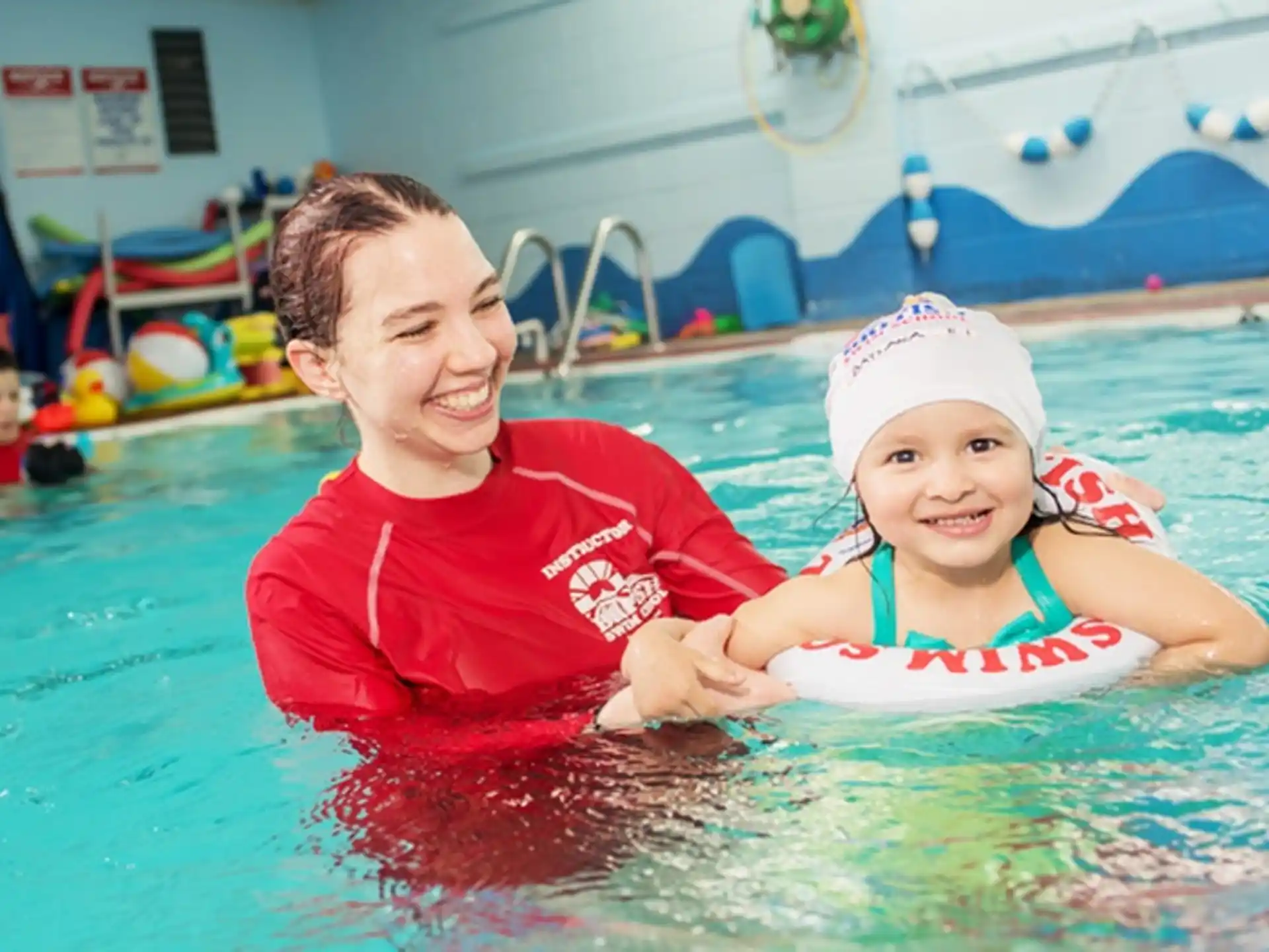 a person and a child in a pool