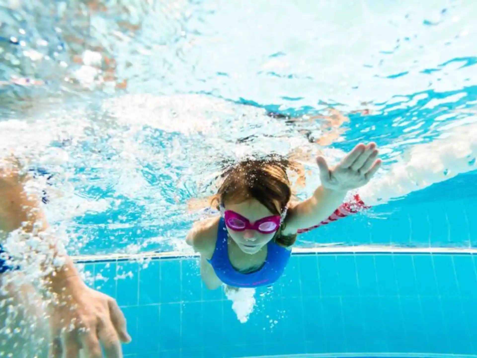 a person swimming in a pool