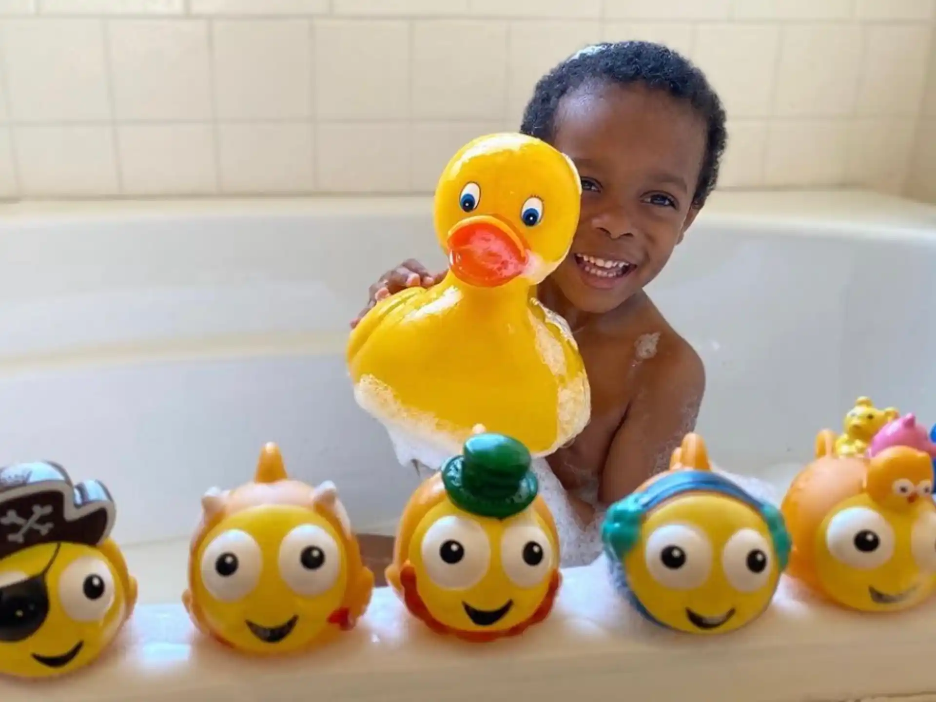 a group of rubber ducks in a bathtub