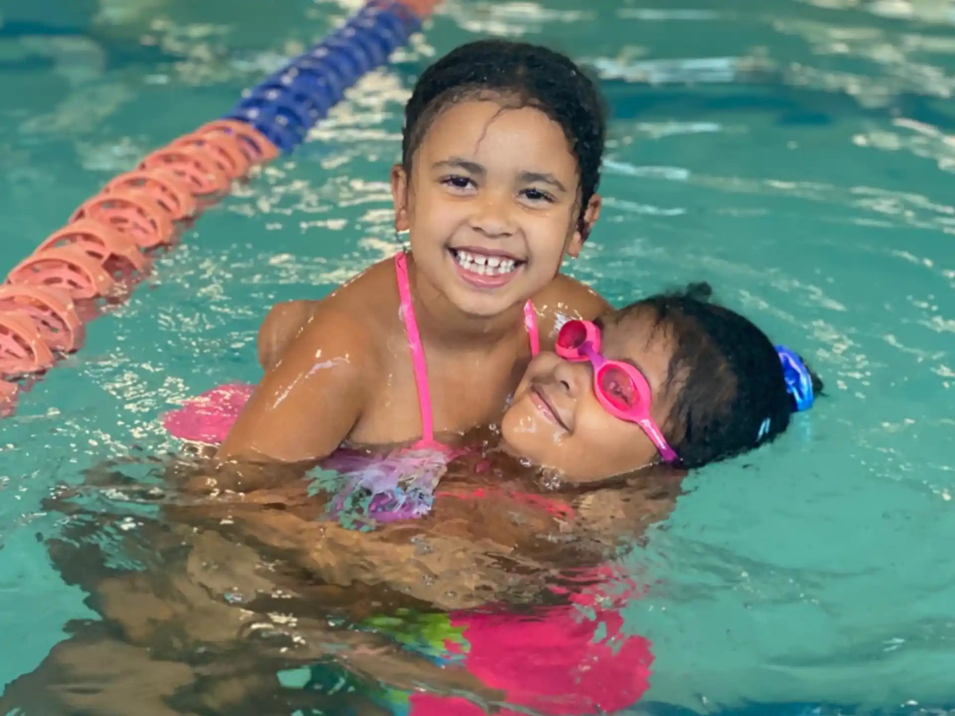a person and a child in a pool