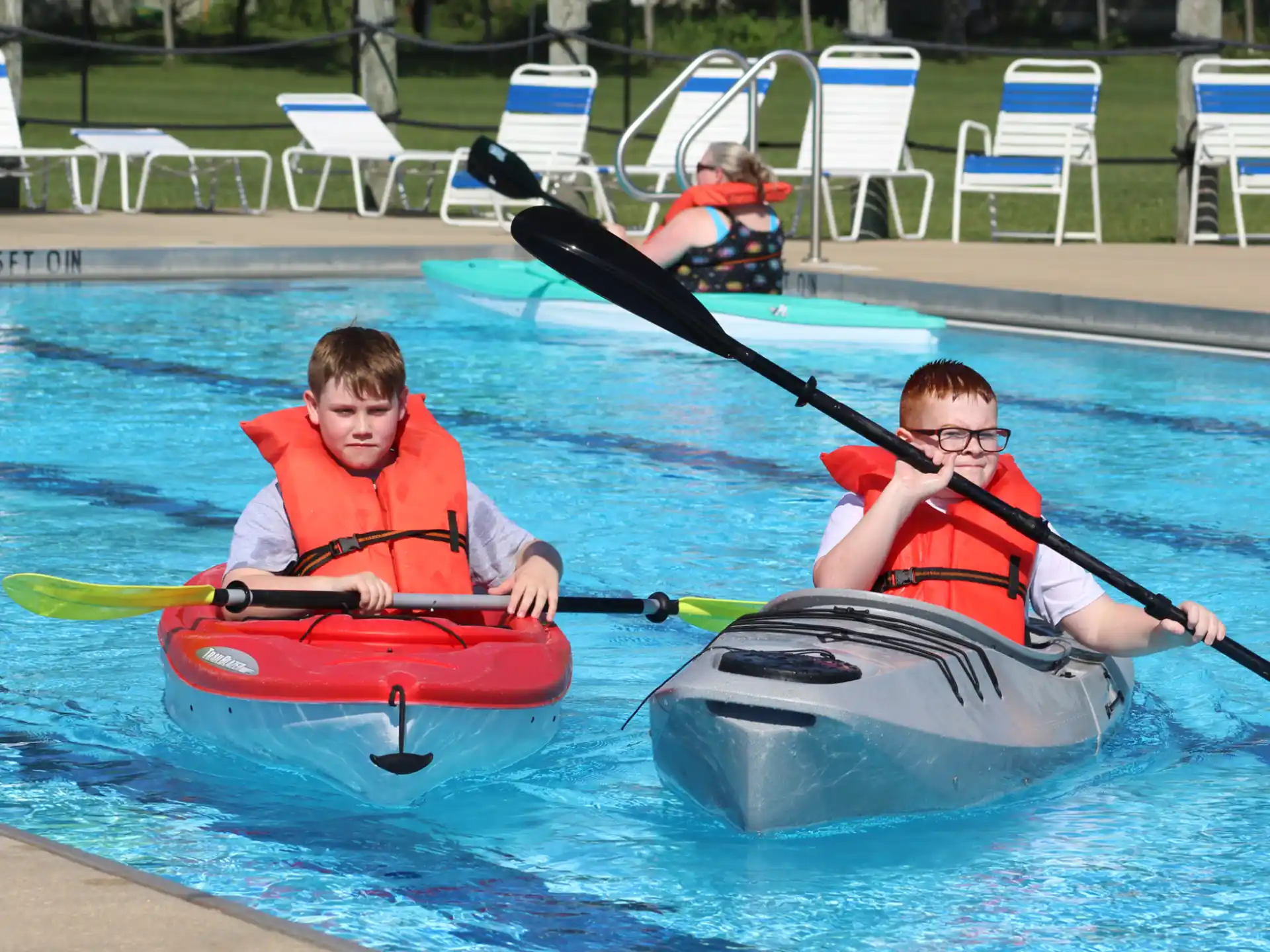 a group of people in kayaks