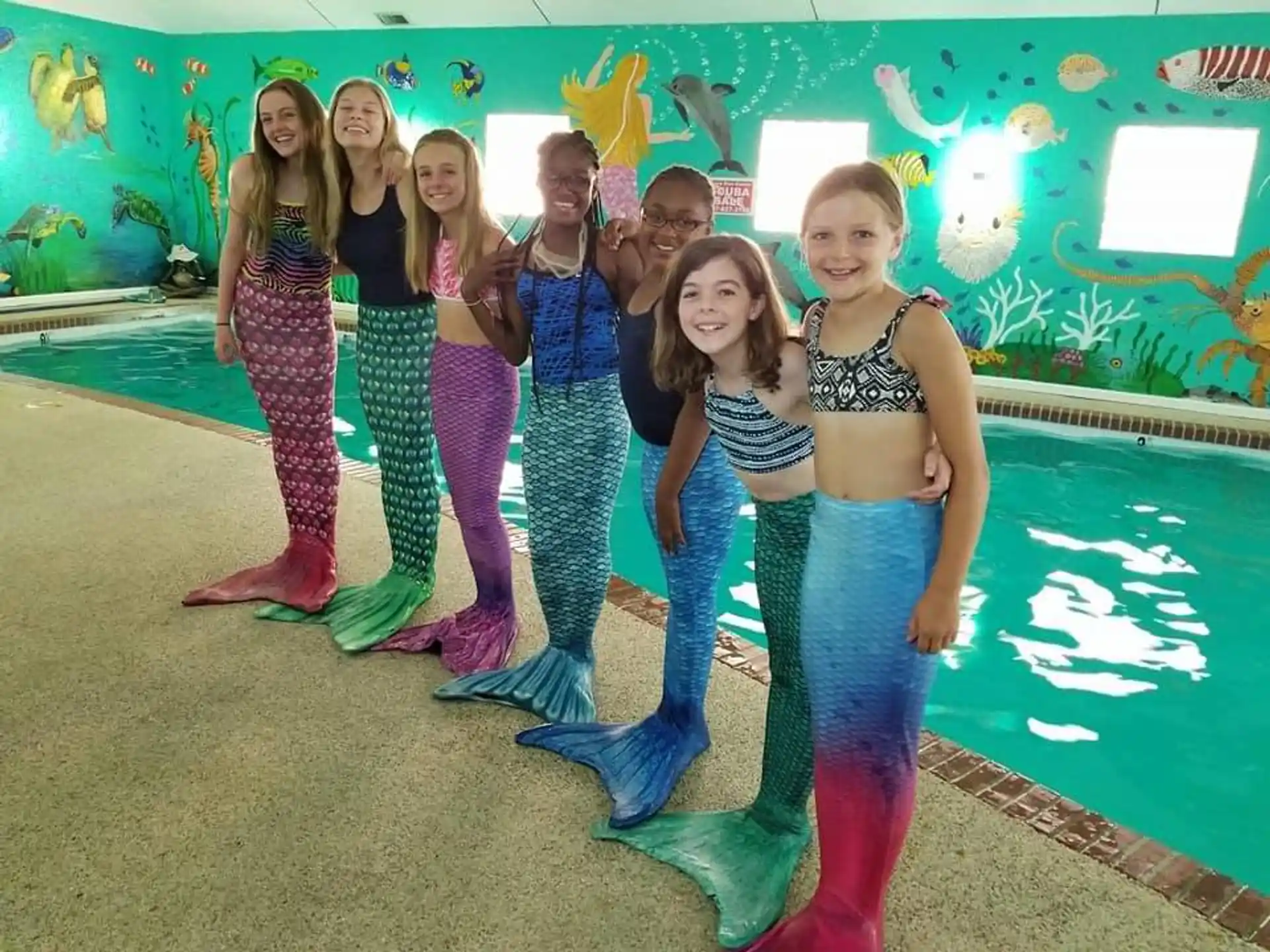a group of women posing for a photo