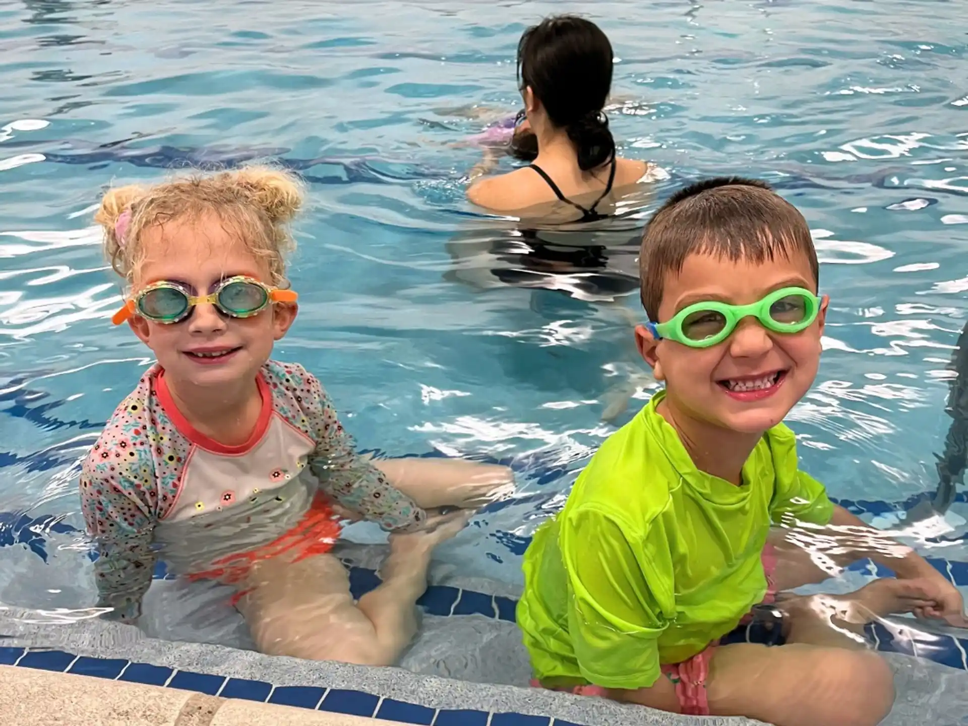 a group of kids in a pool
