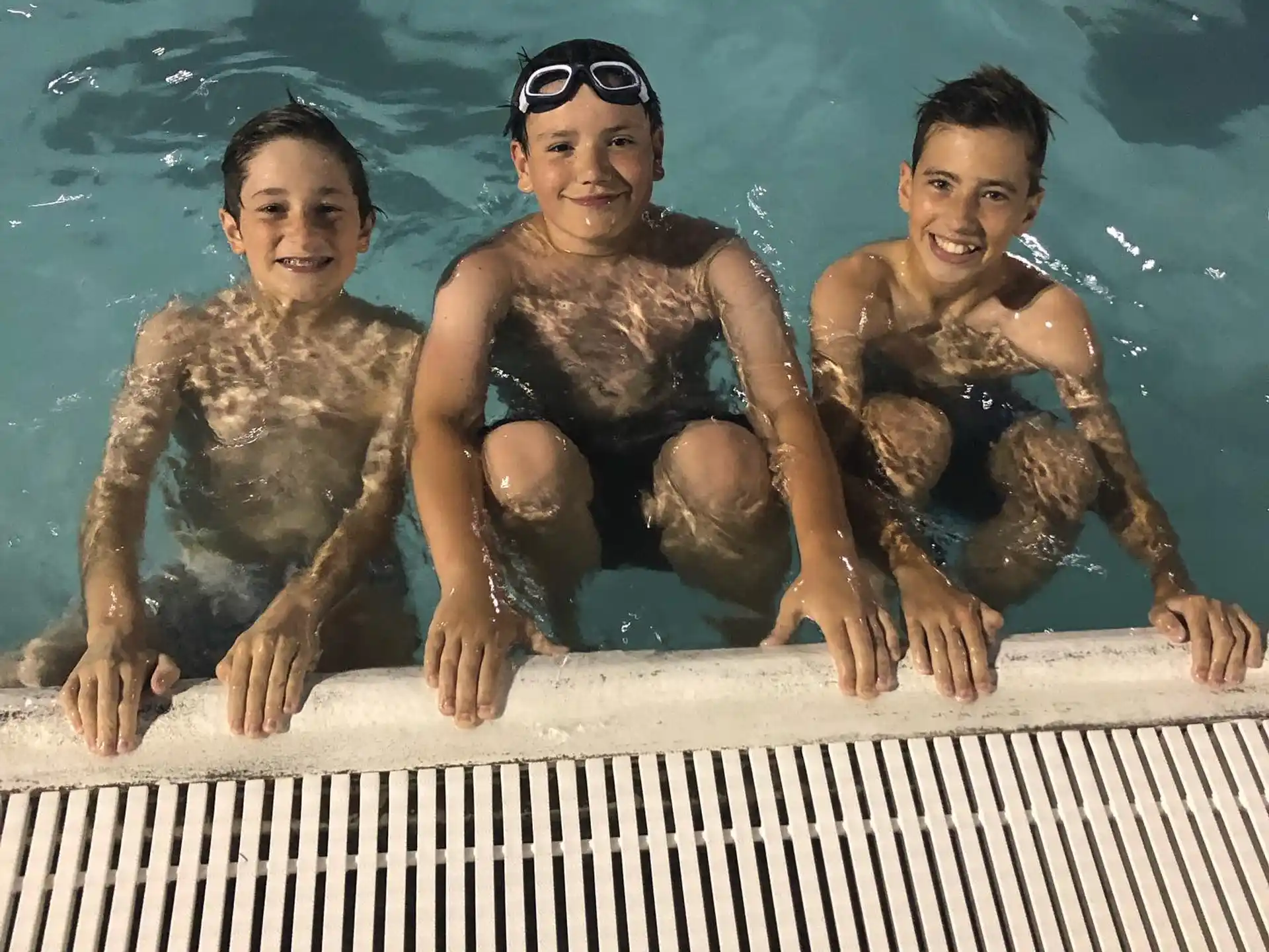 a group of boys in a pool