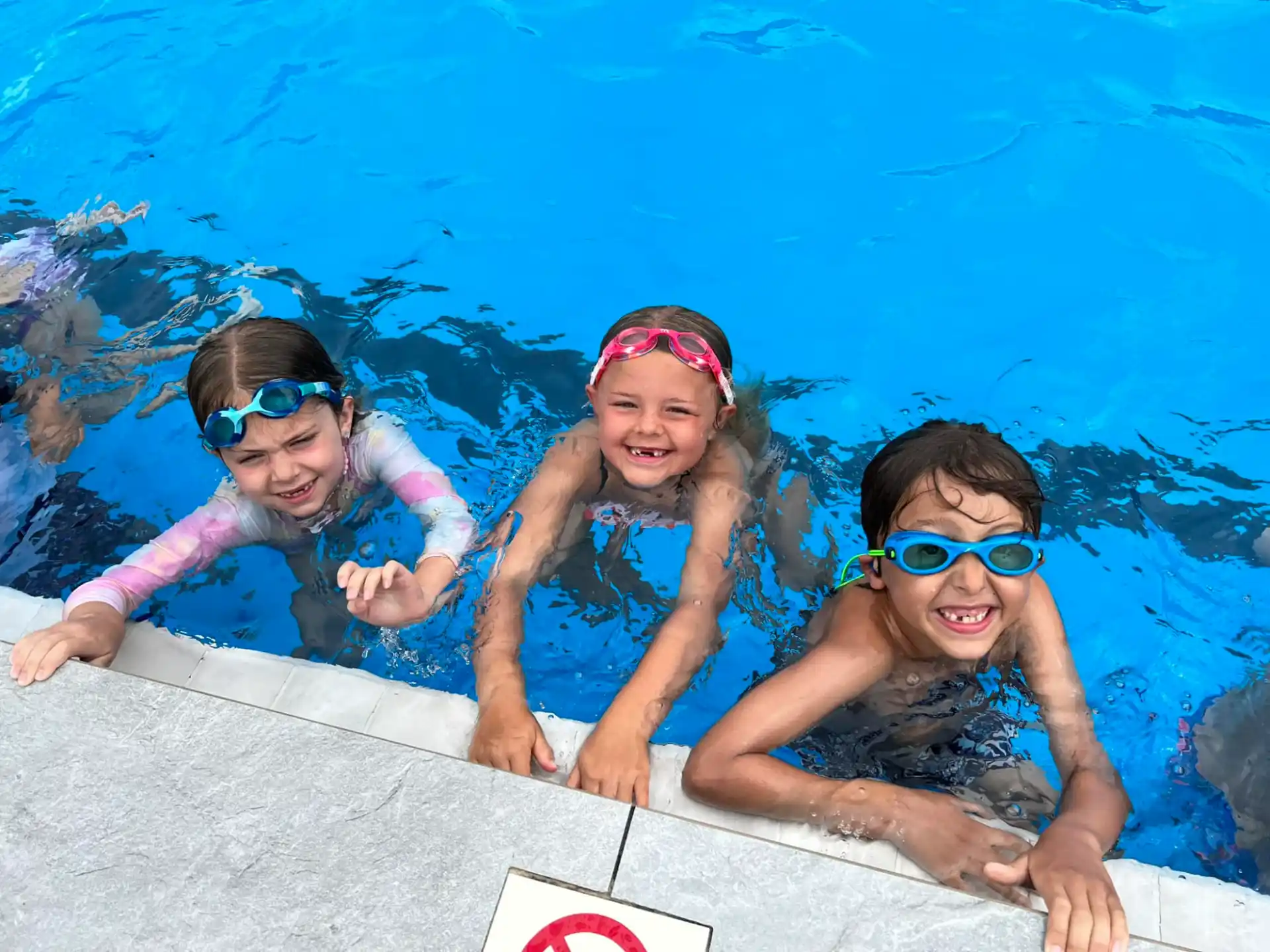 a group of kids in a pool