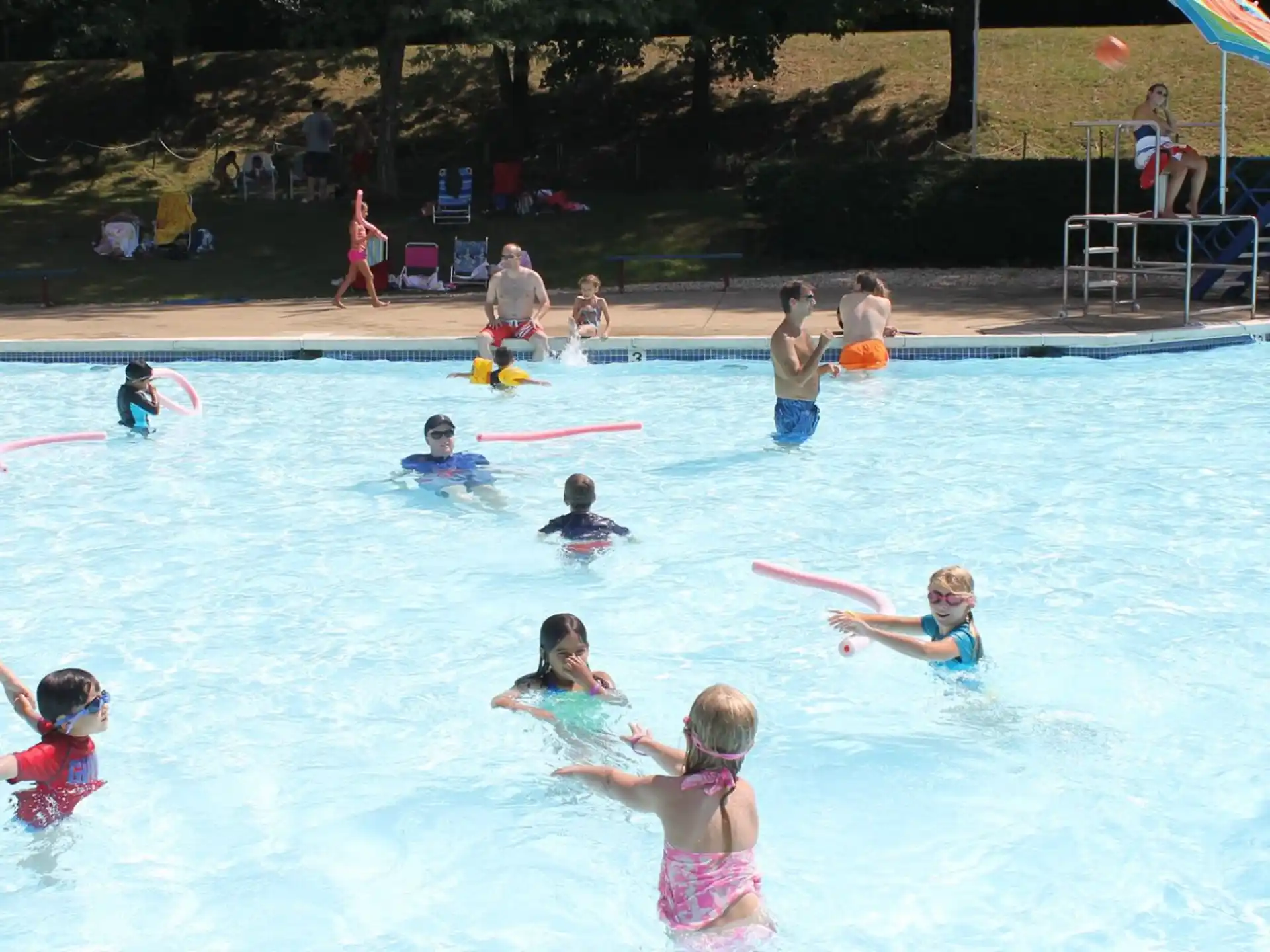 a group of people playing in a pool