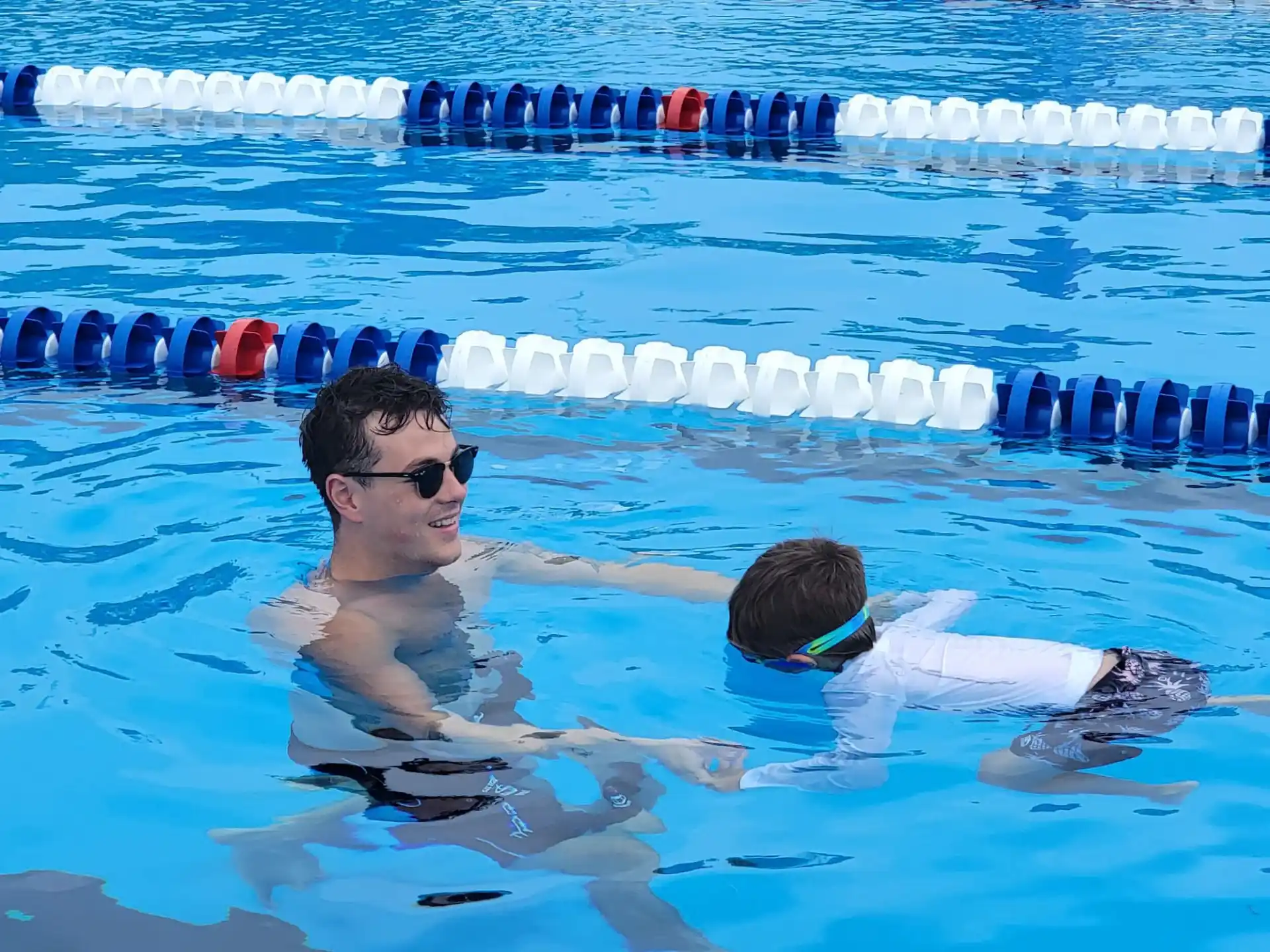 a man and a woman in a pool