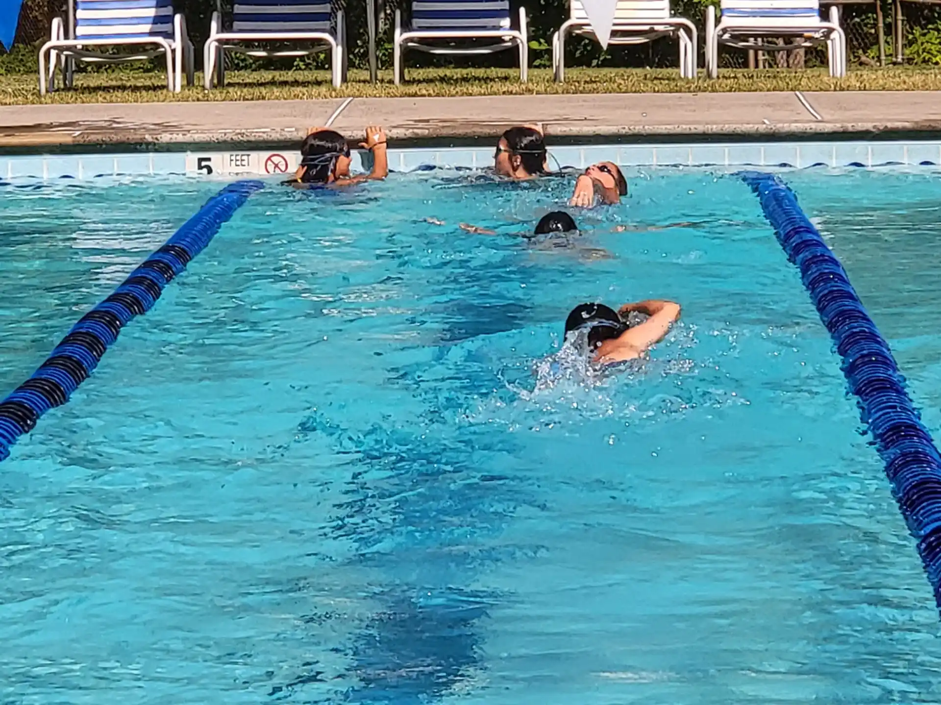 a group of people in a pool