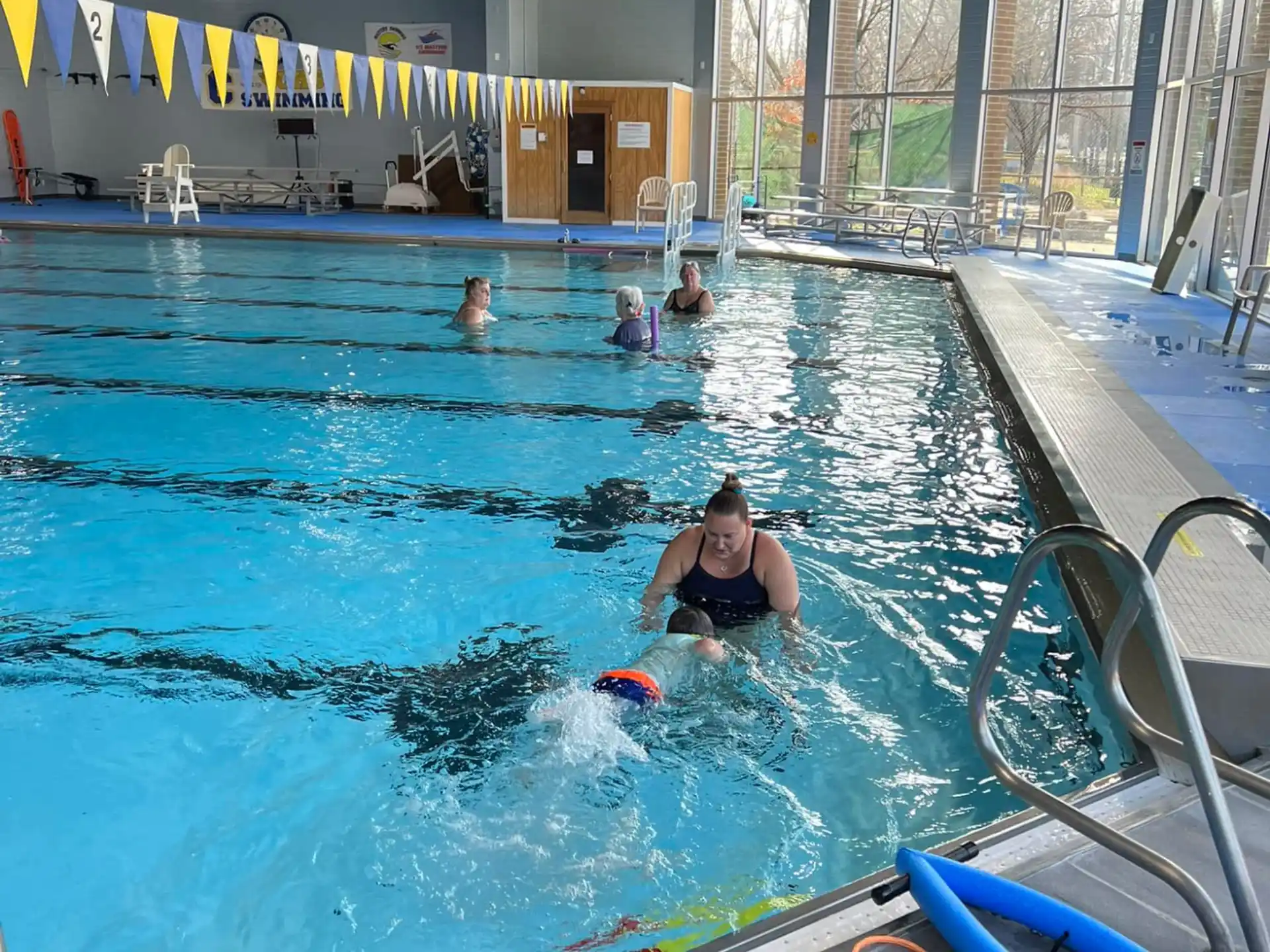 a group of people in a swimming pool