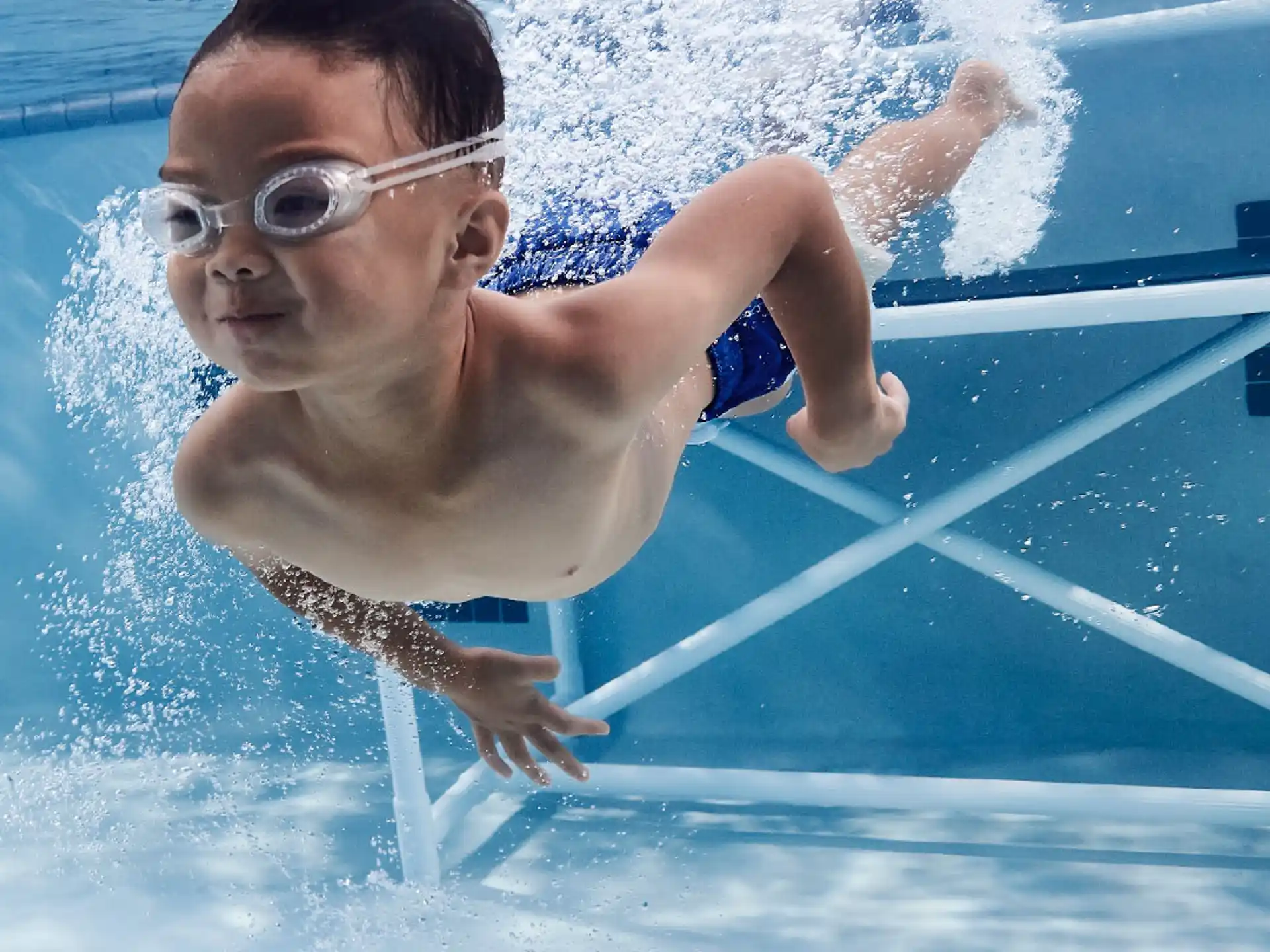 a boy in a pool