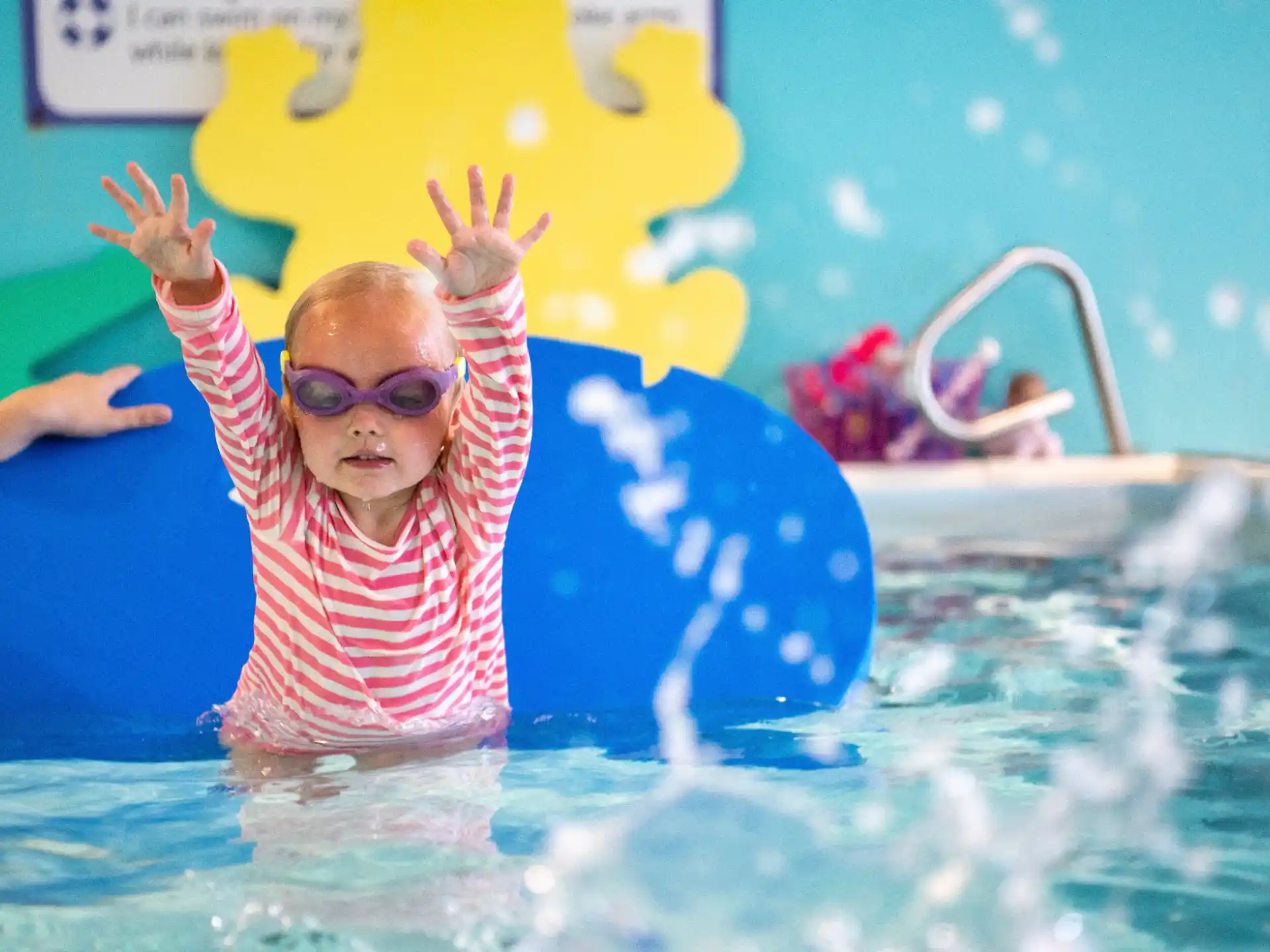 a baby in a pool