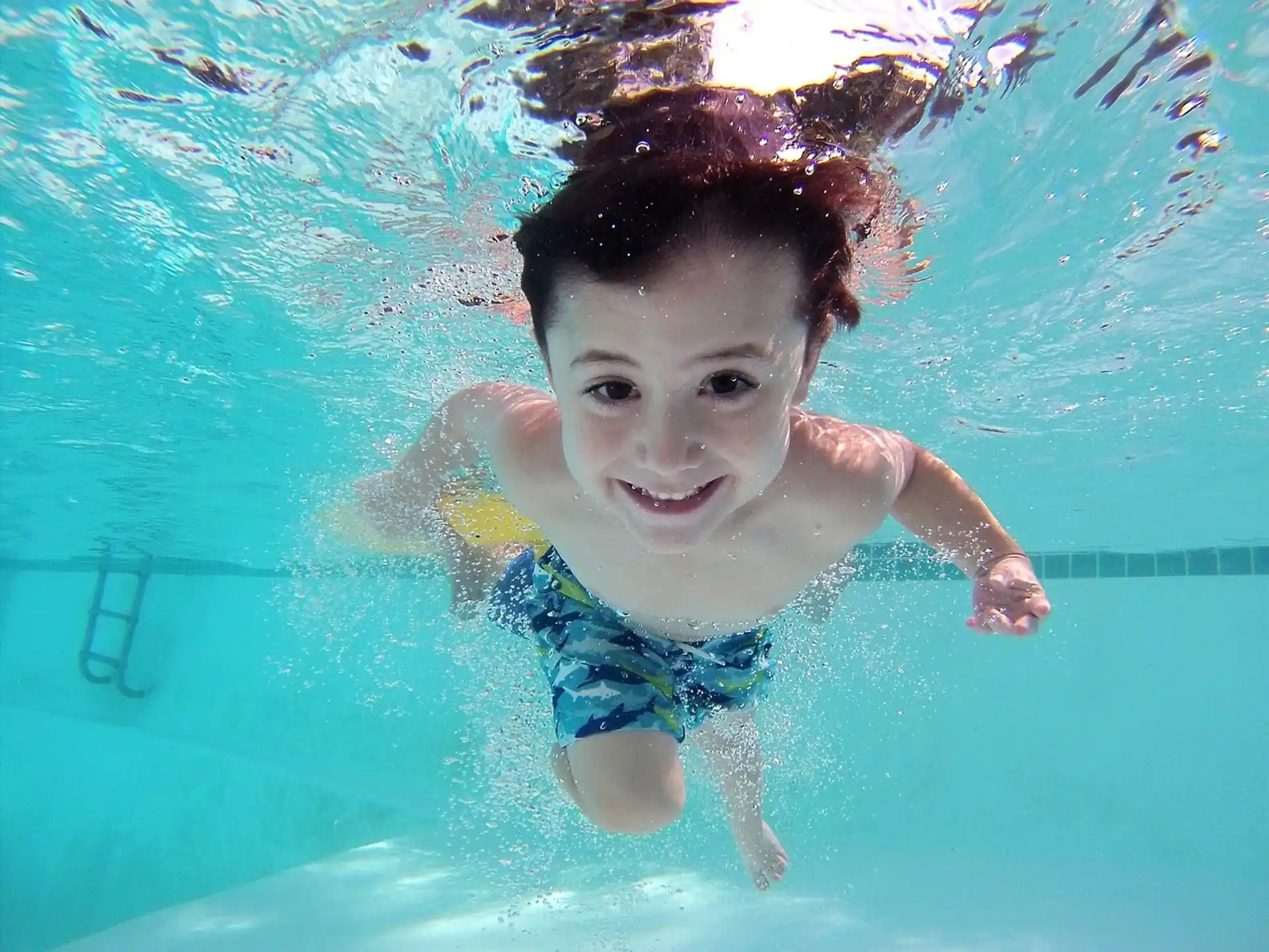 a boy in a pool