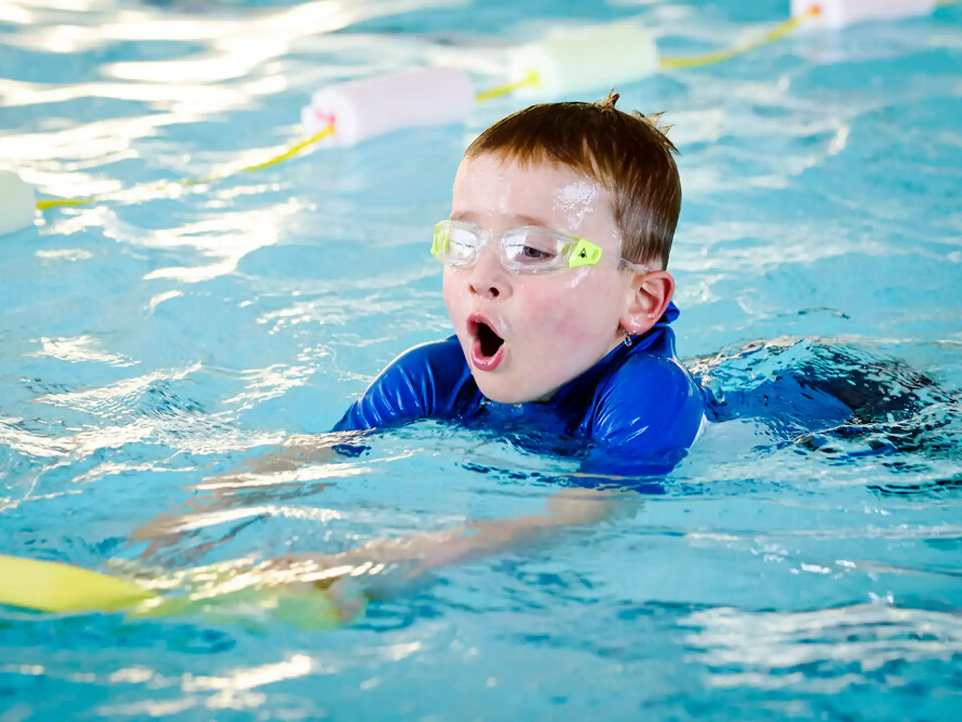 a boy in a pool
