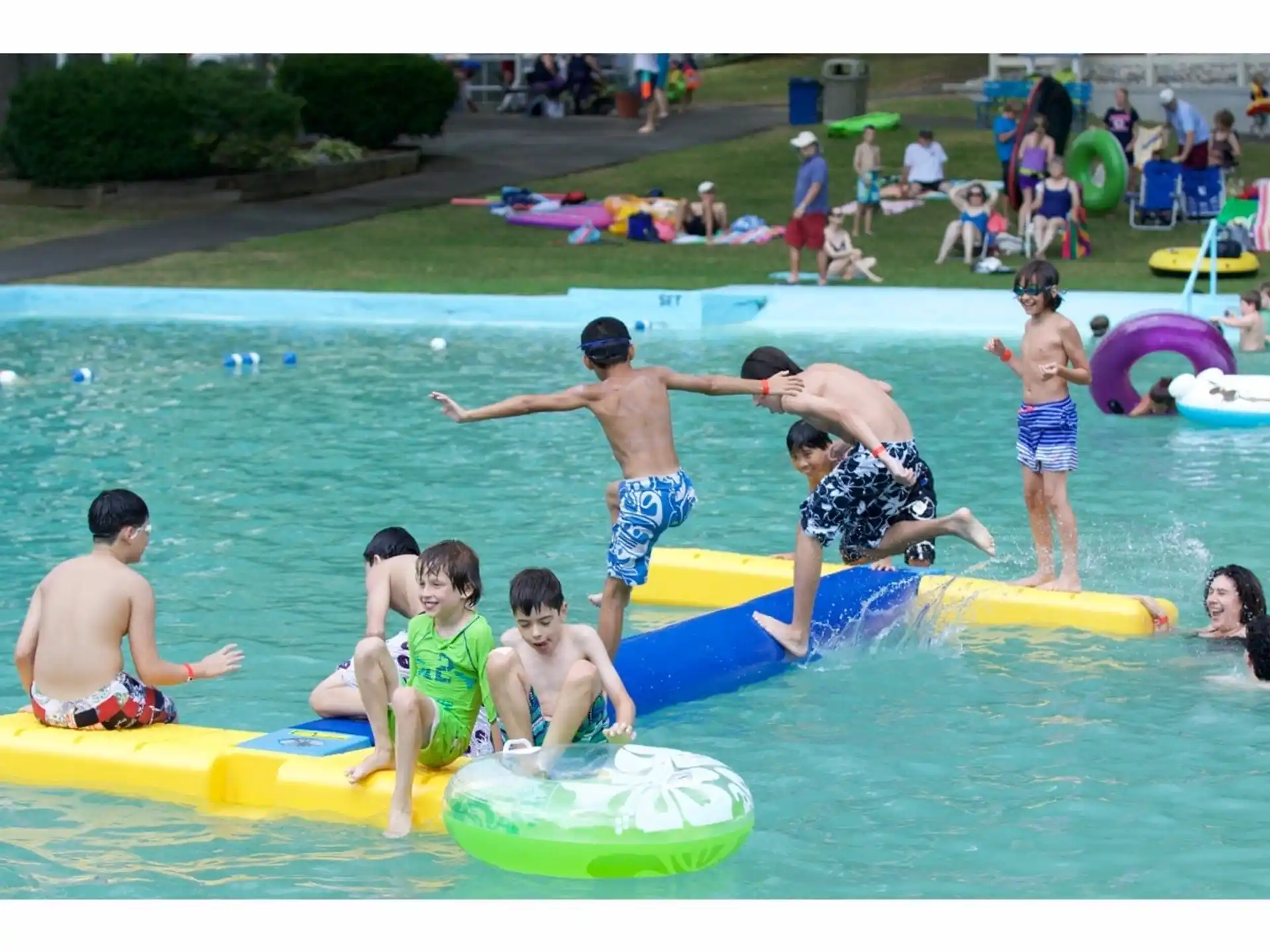 a group of people playing in a pool