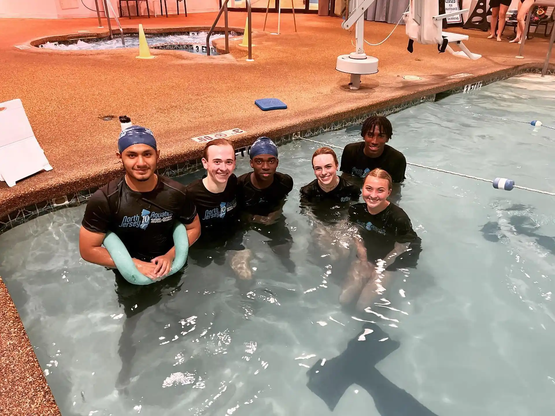 a group of people in a pool