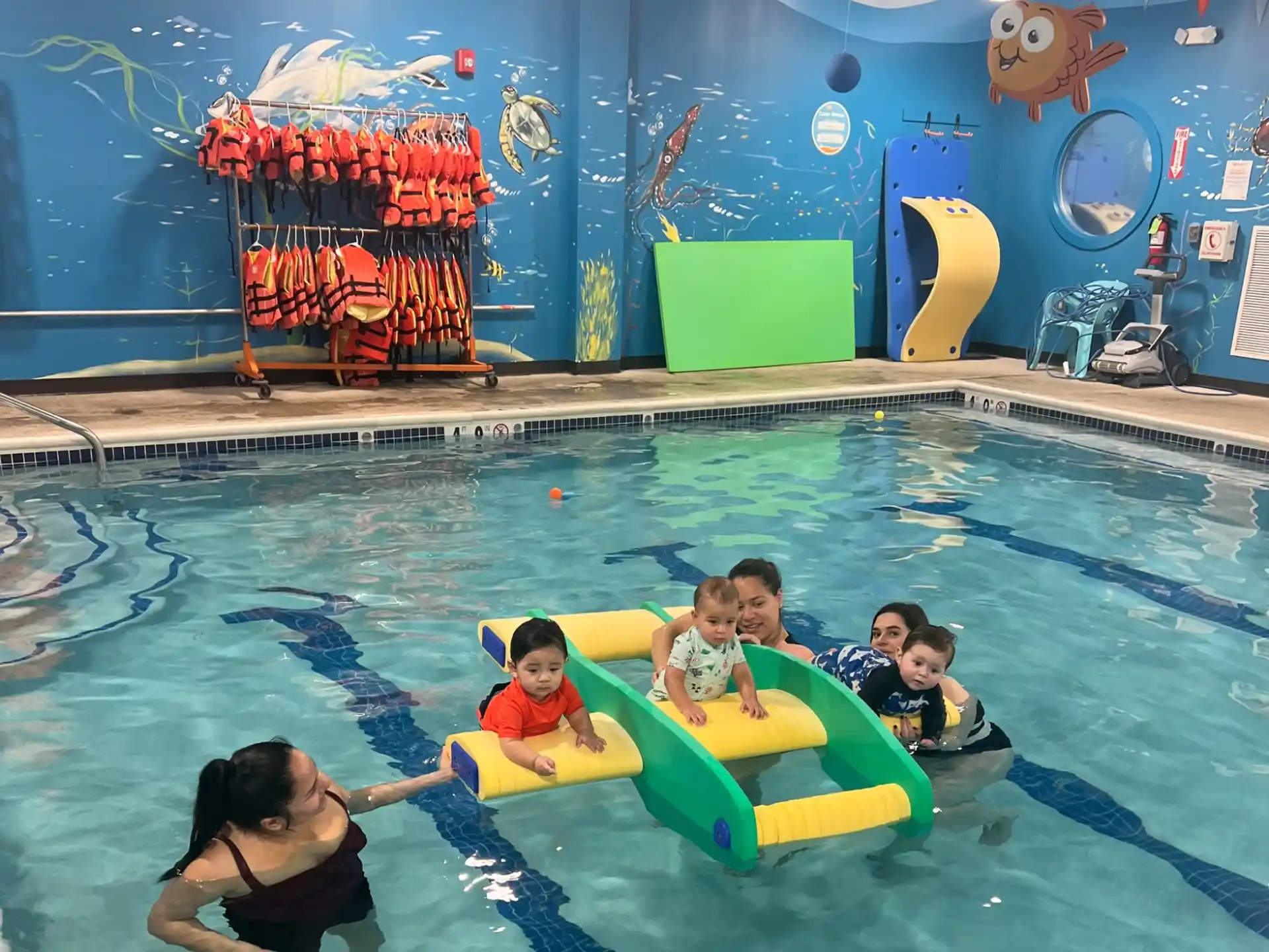 a group of kids in a pool