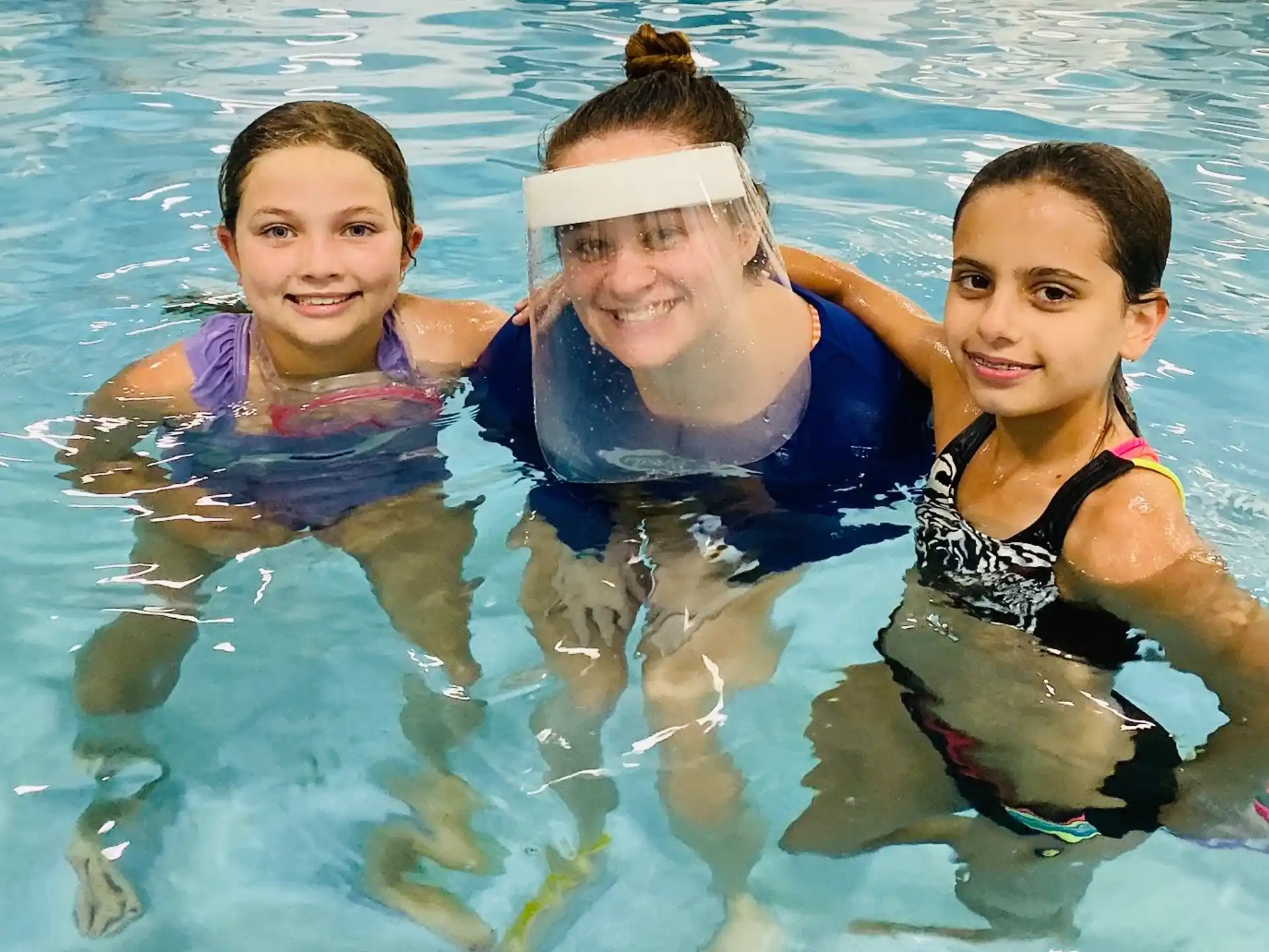 a group of people in a pool