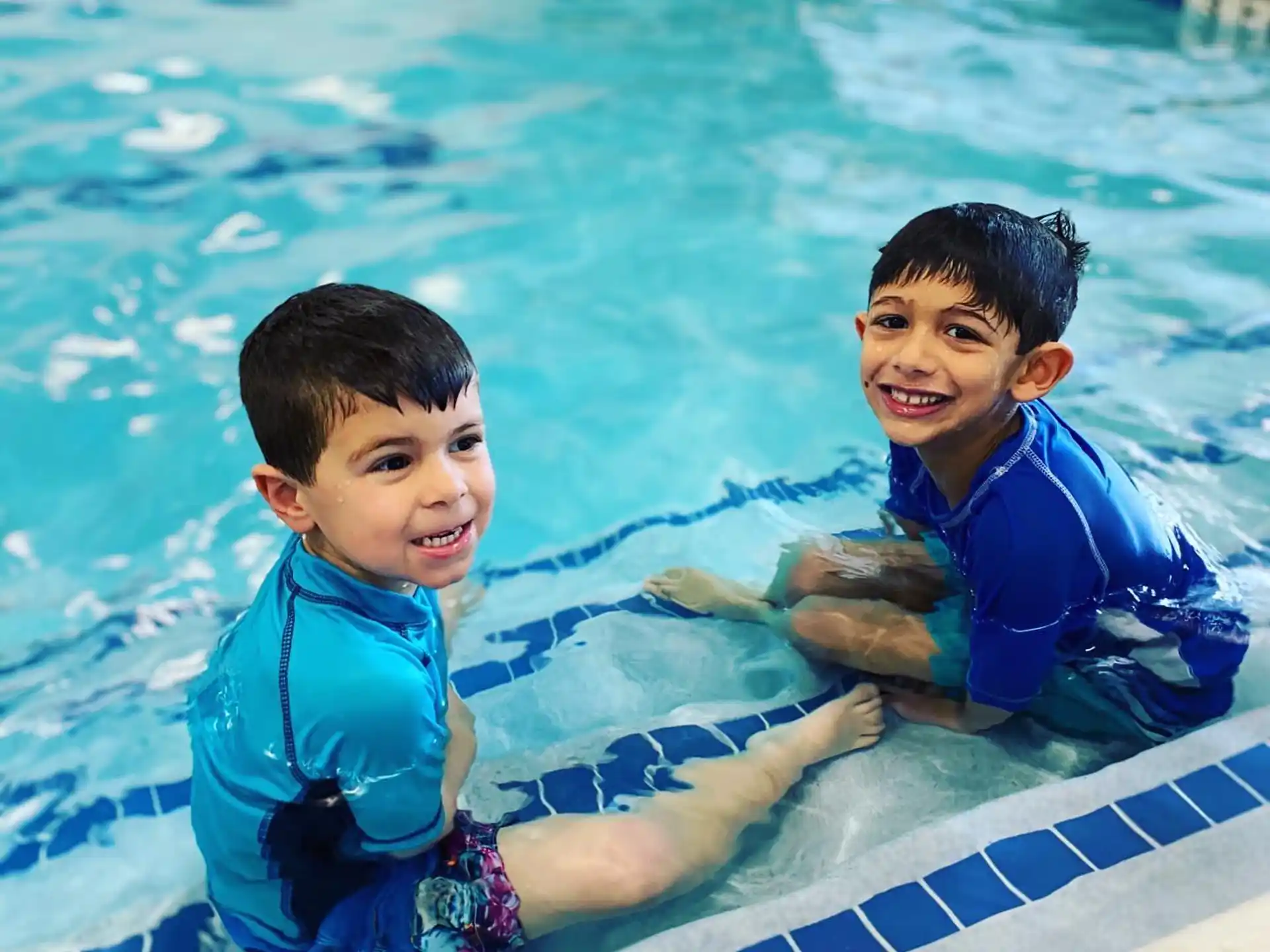 two boys in a pool