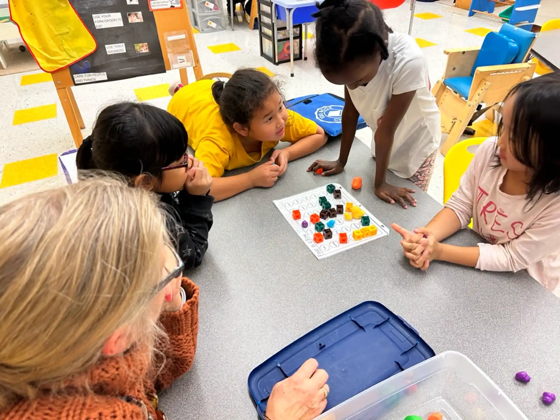 a group of children playing a board game