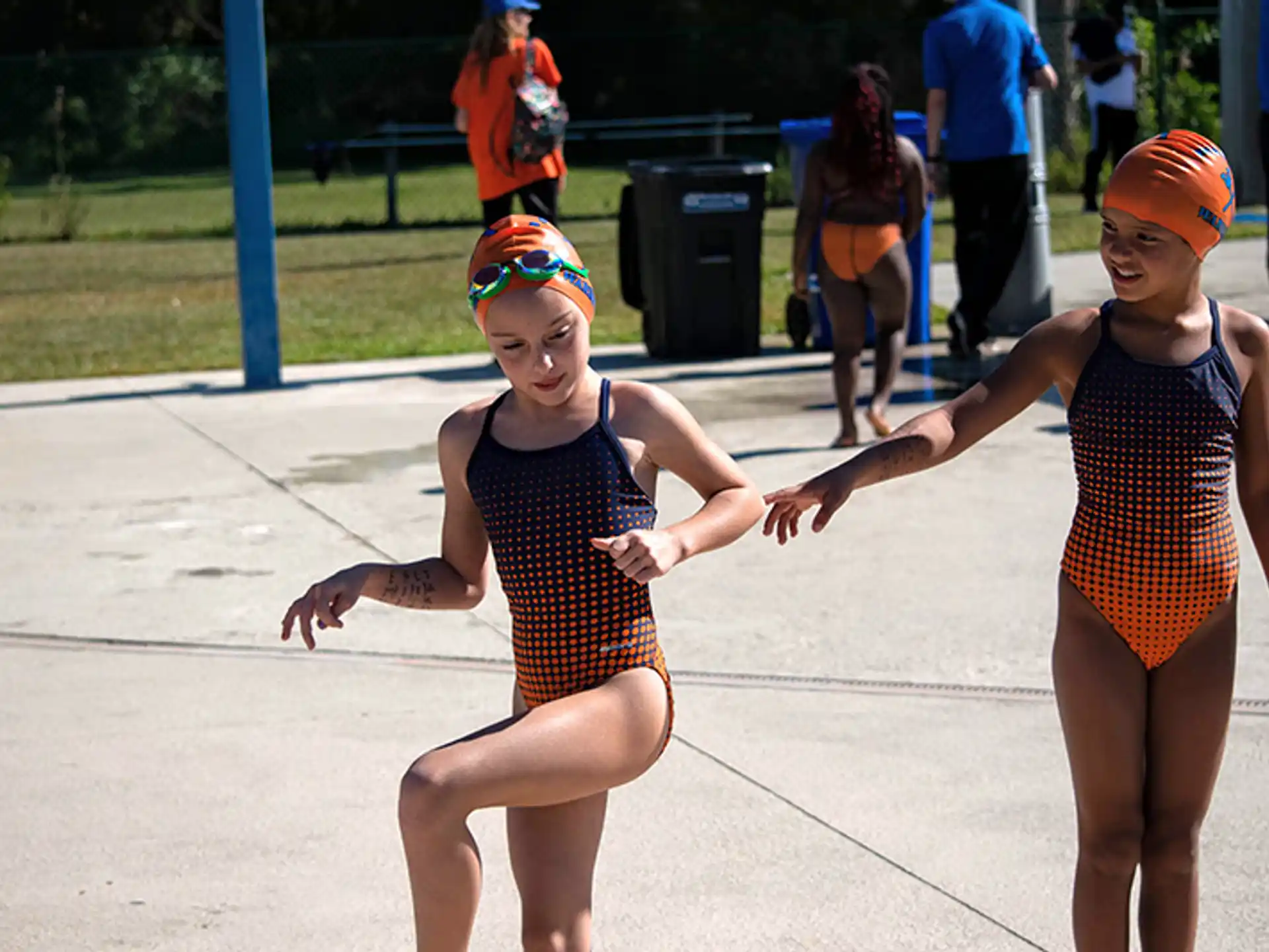 two girls wearing swimsuits