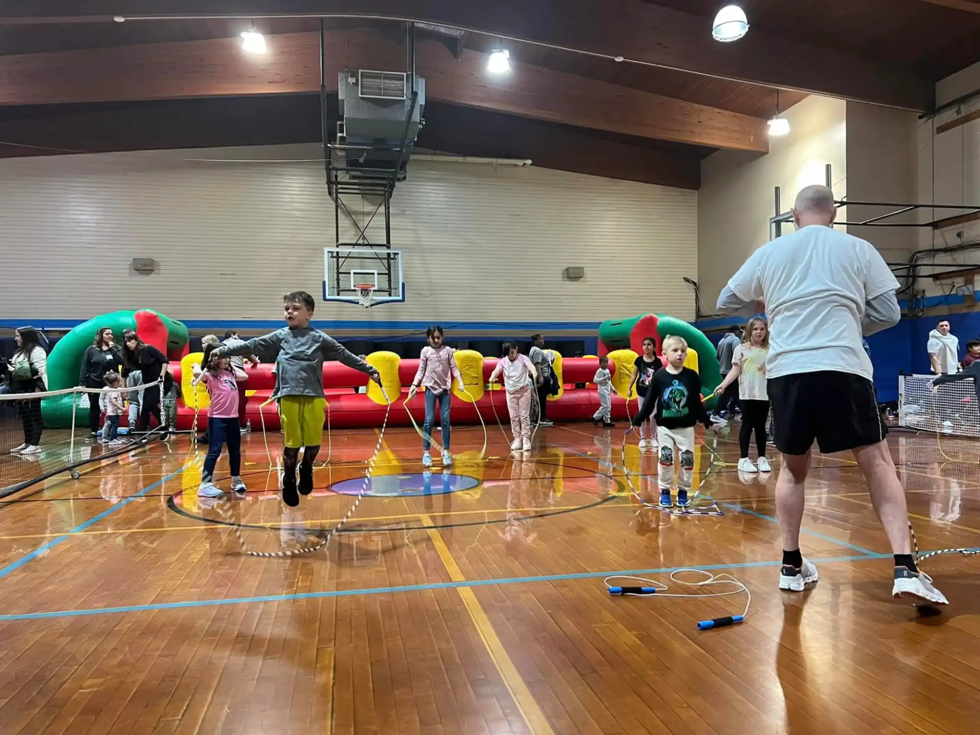 a group of people playing volleyball