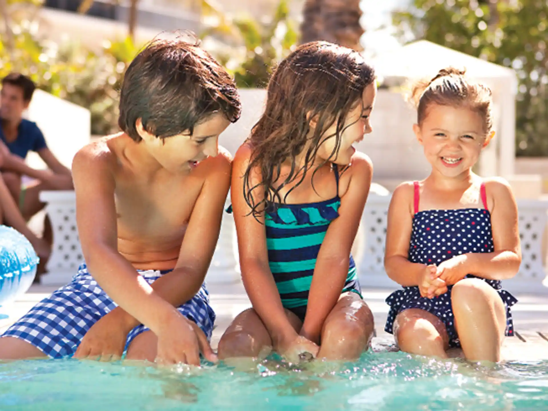 a group of children in a pool