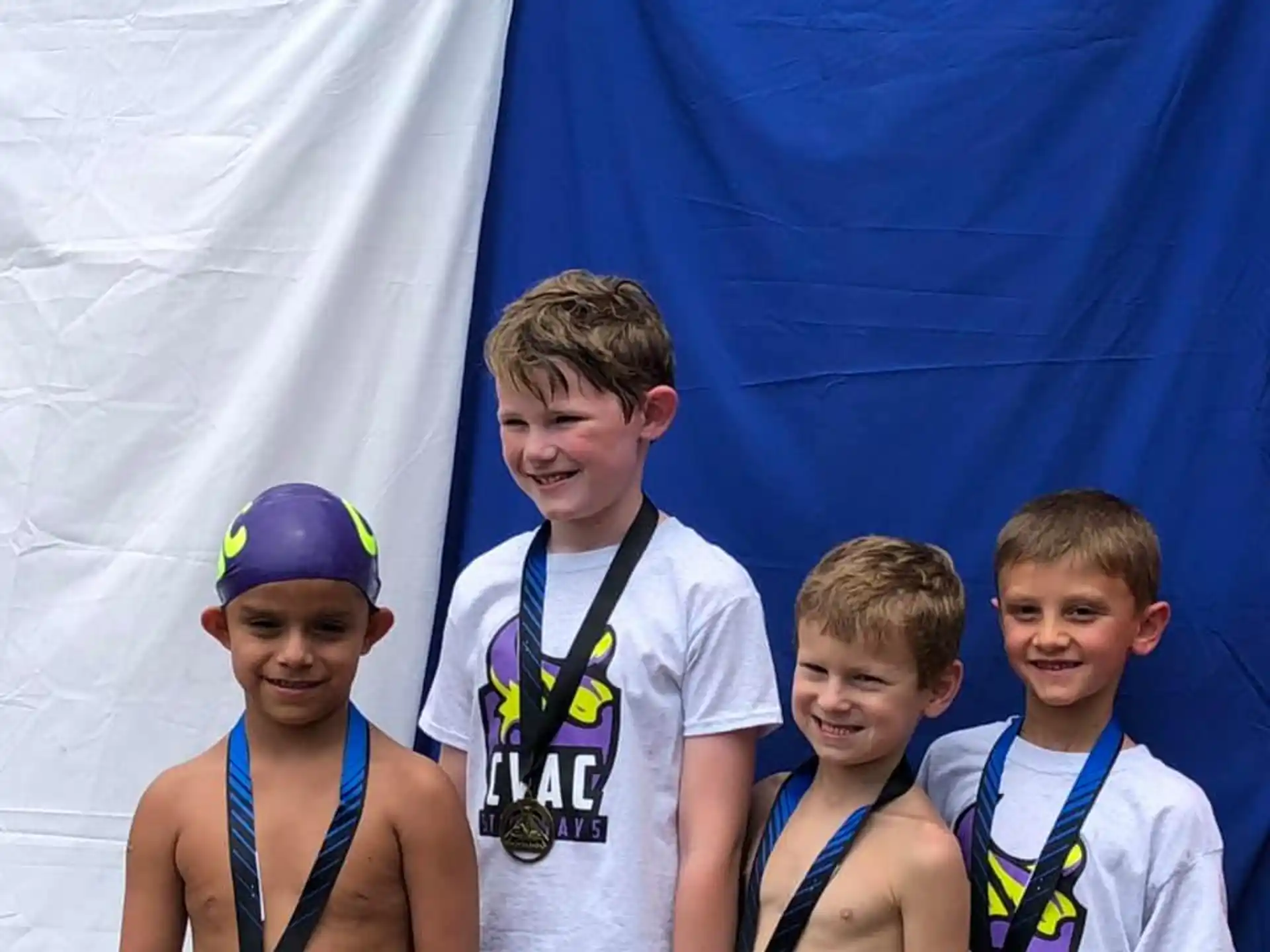 a group of boys posing for a picture