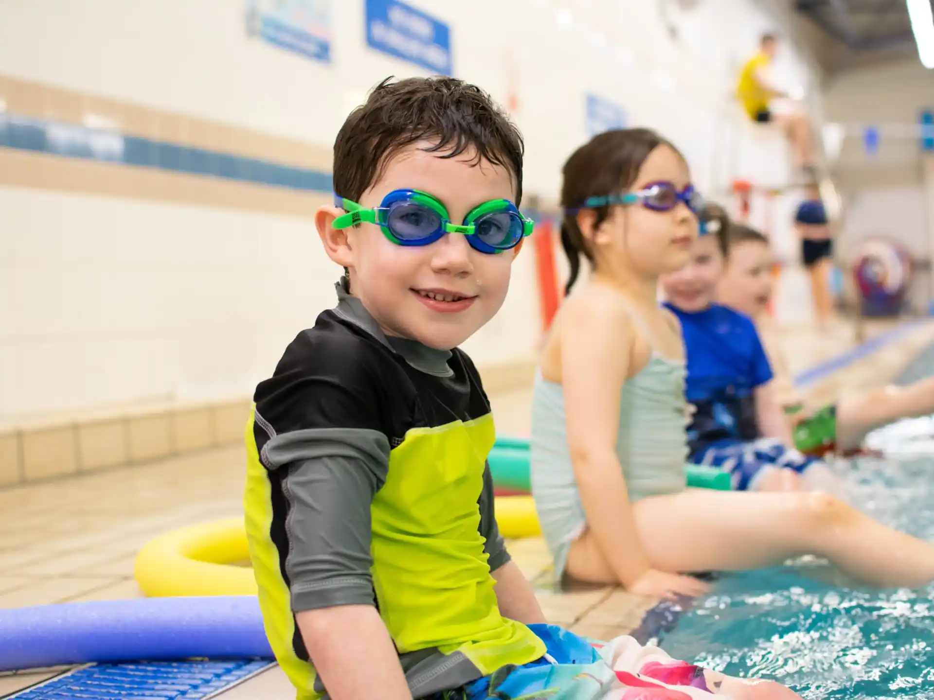a group of kids in a pool