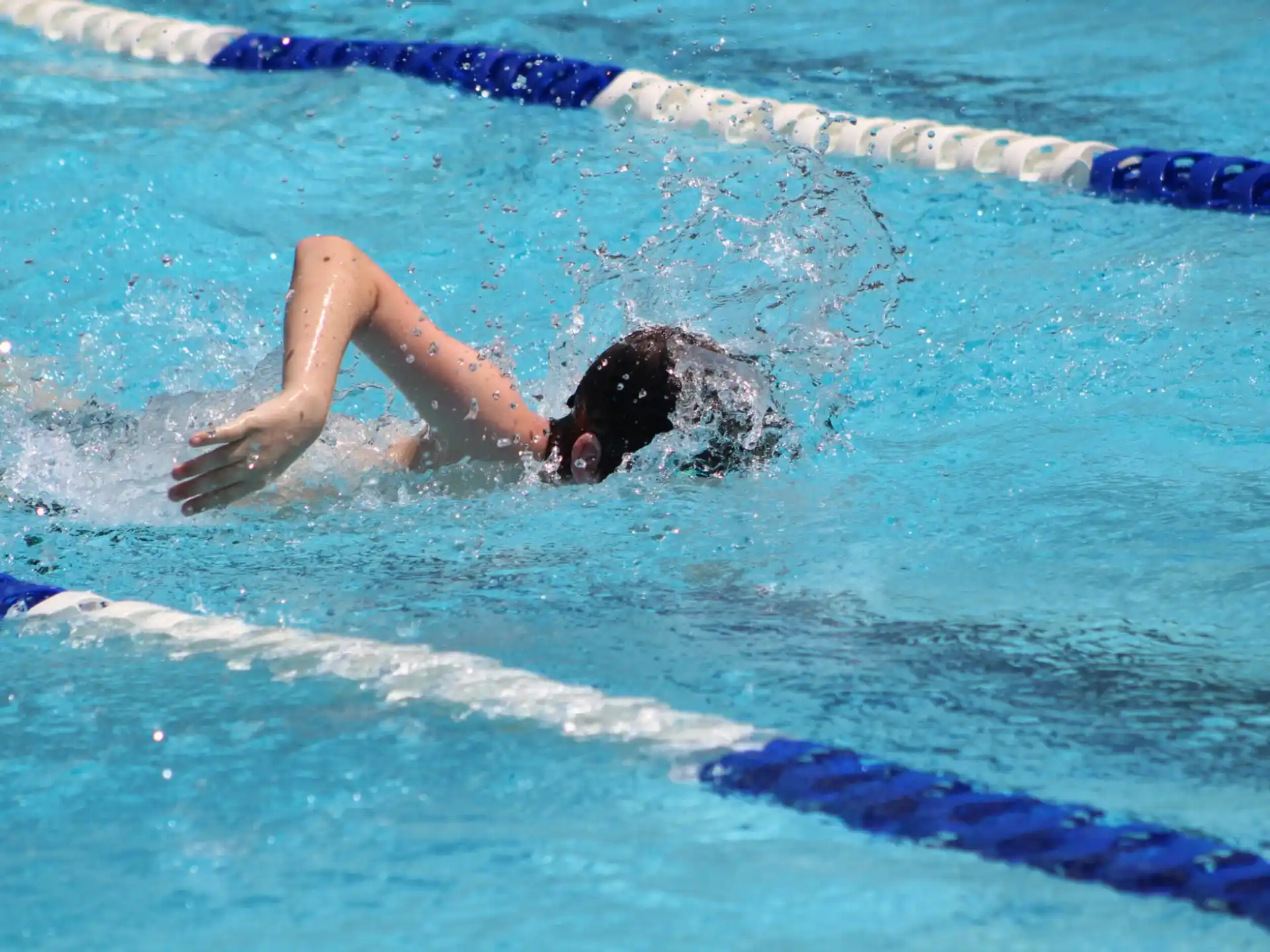 a person swimming in a pool