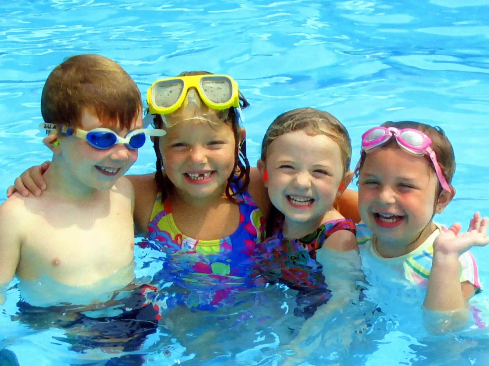 a group of kids in a pool