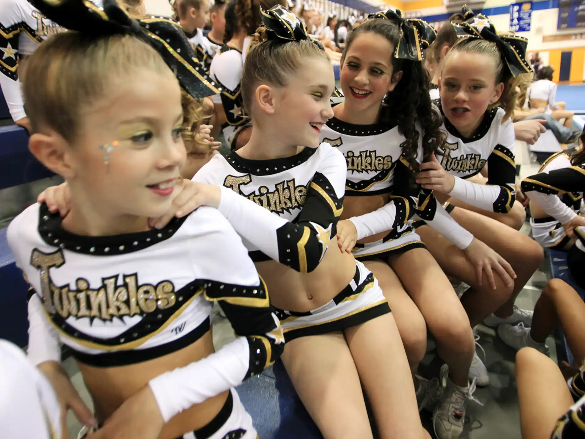 a group of girls in athletic uniforms