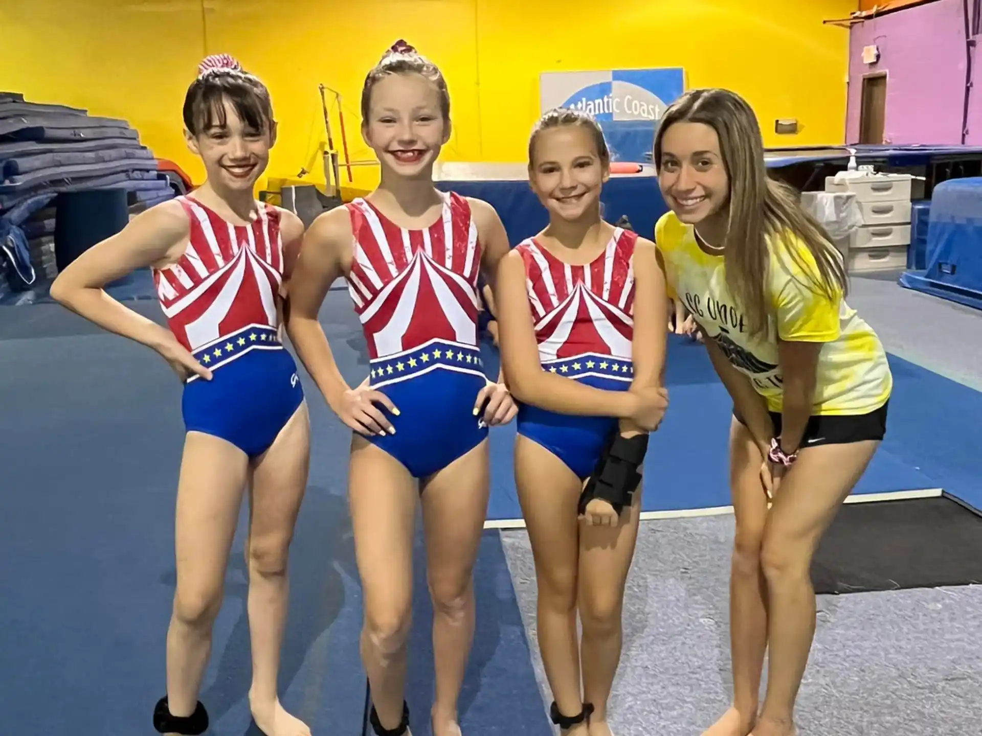 a group of girls in athletic uniforms