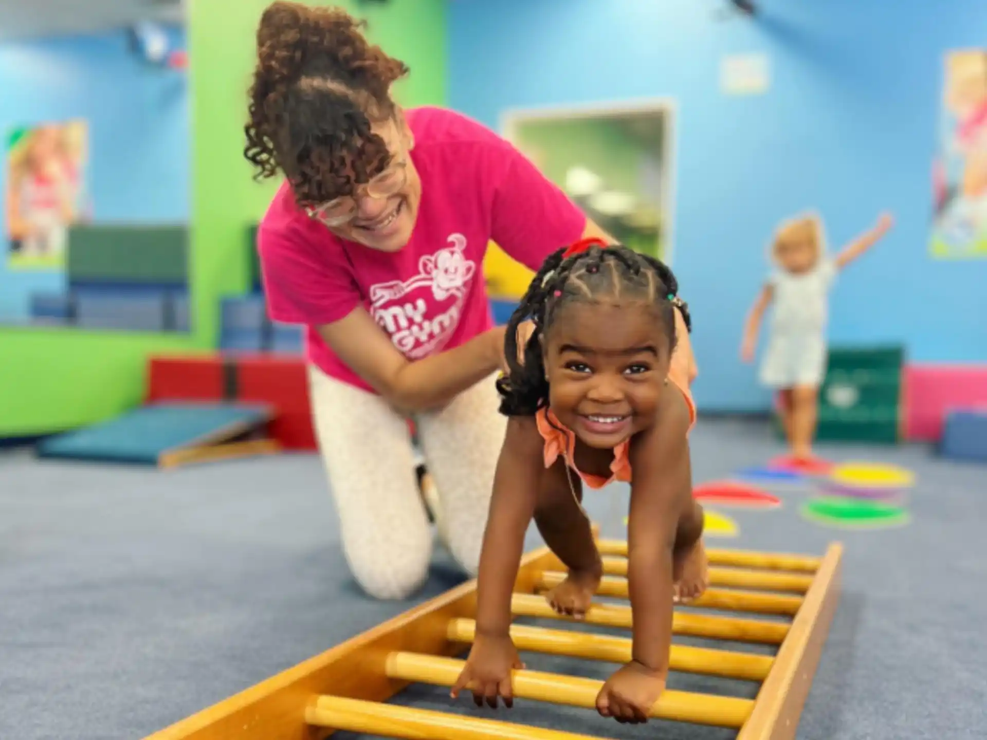 a person and a child on a mat
