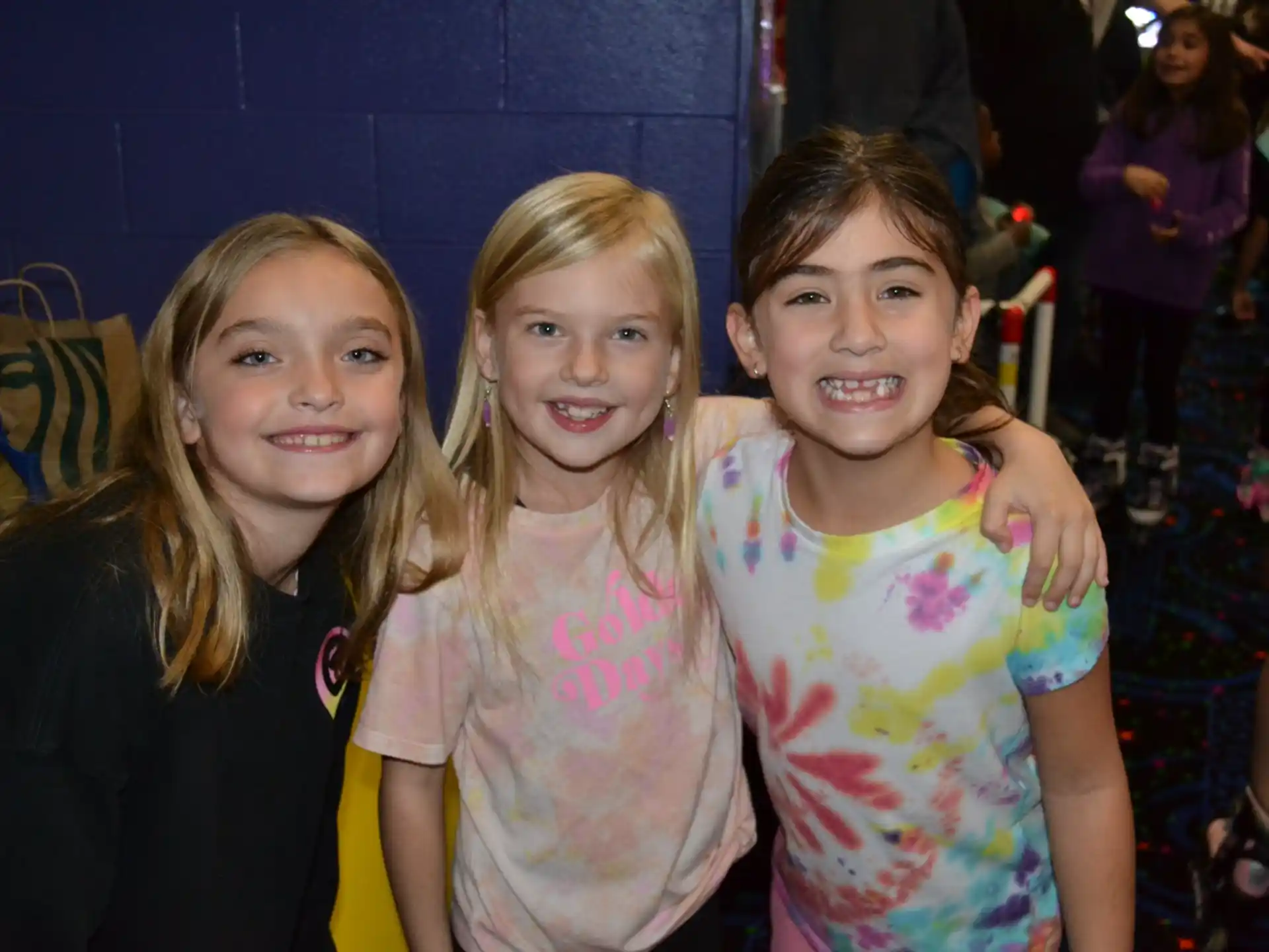 a group of girls smiling