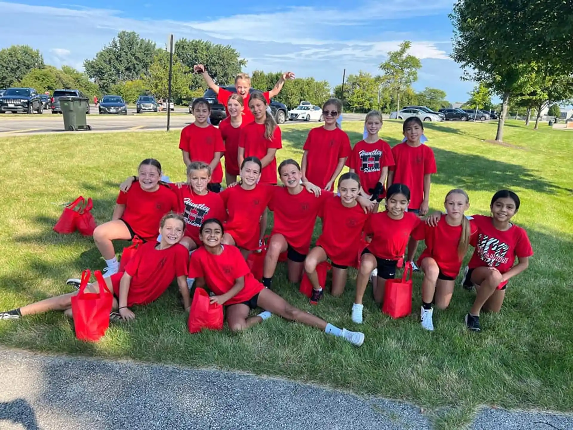 a group of people wearing red shirts