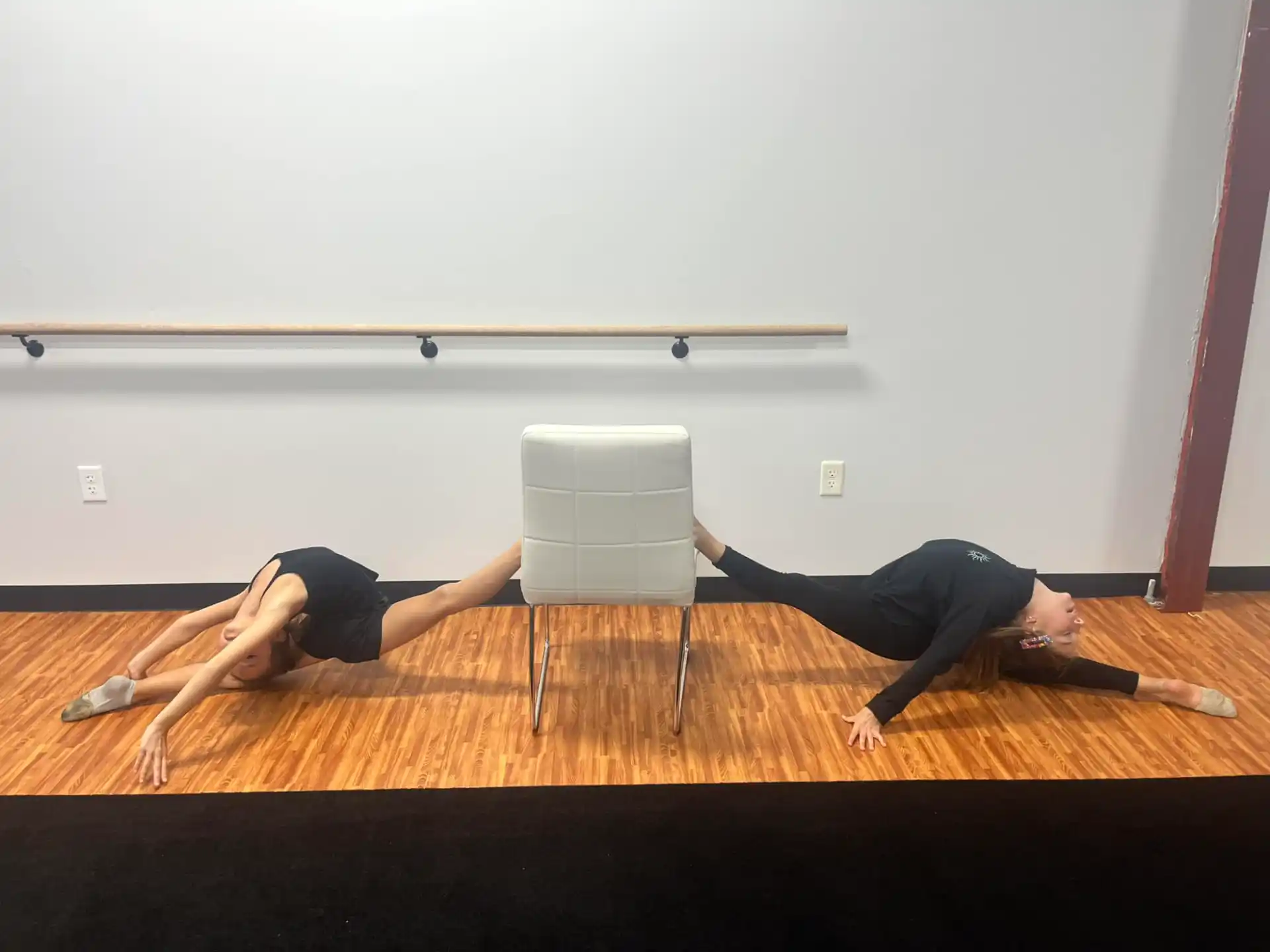 two people doing yoga