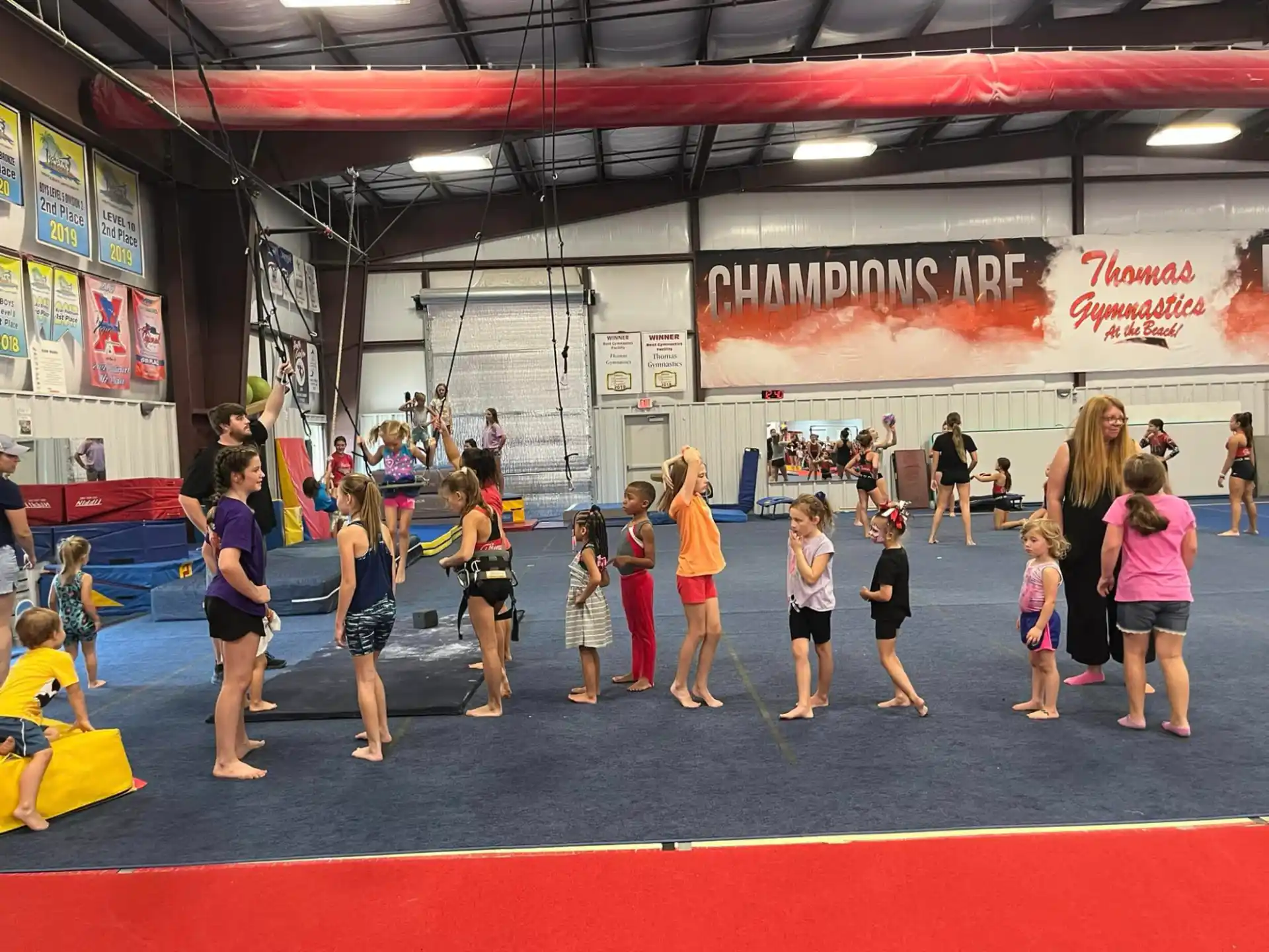 a group of people in a gym