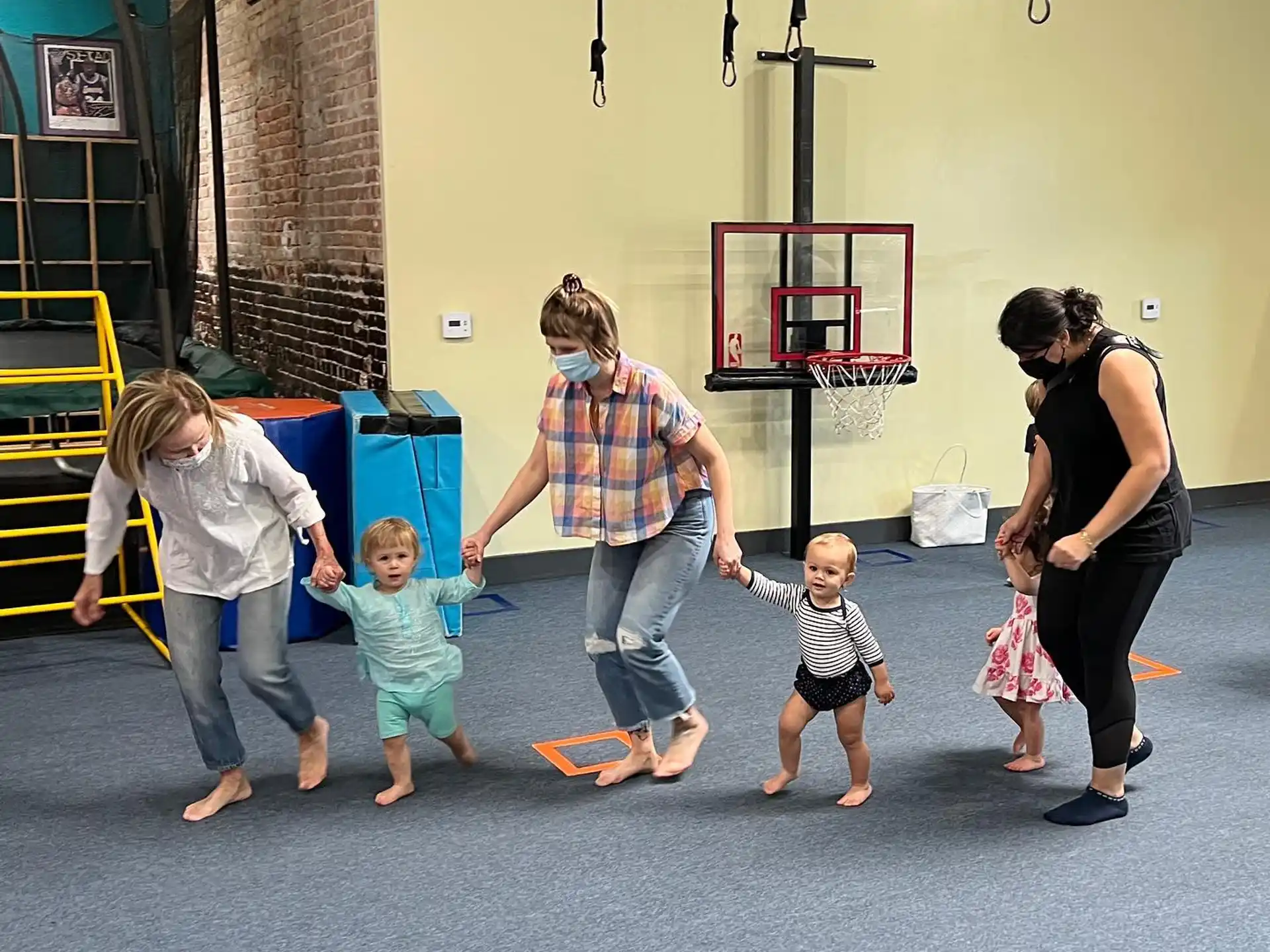 a group of people playing with toys