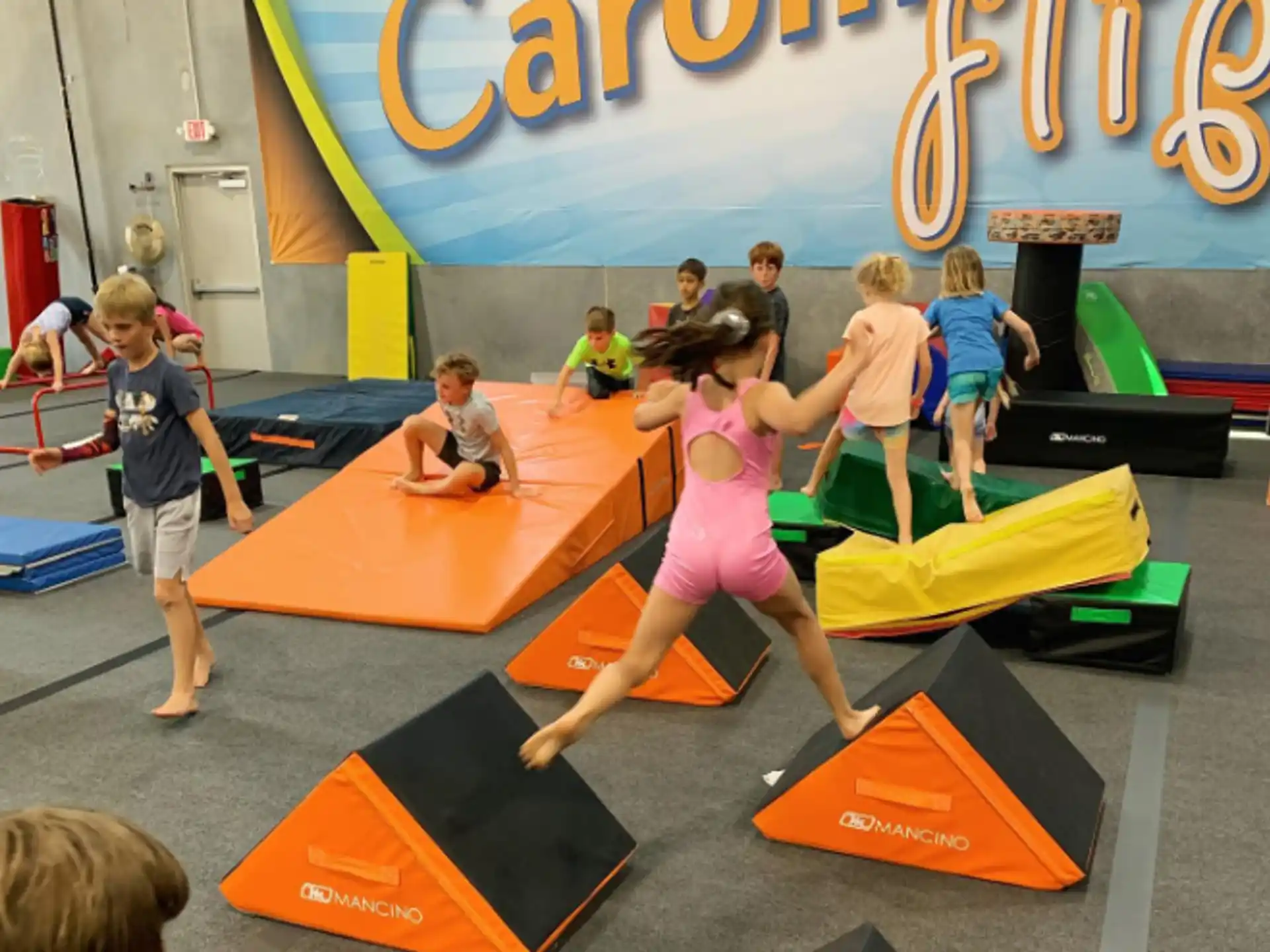 a group of children playing on mats