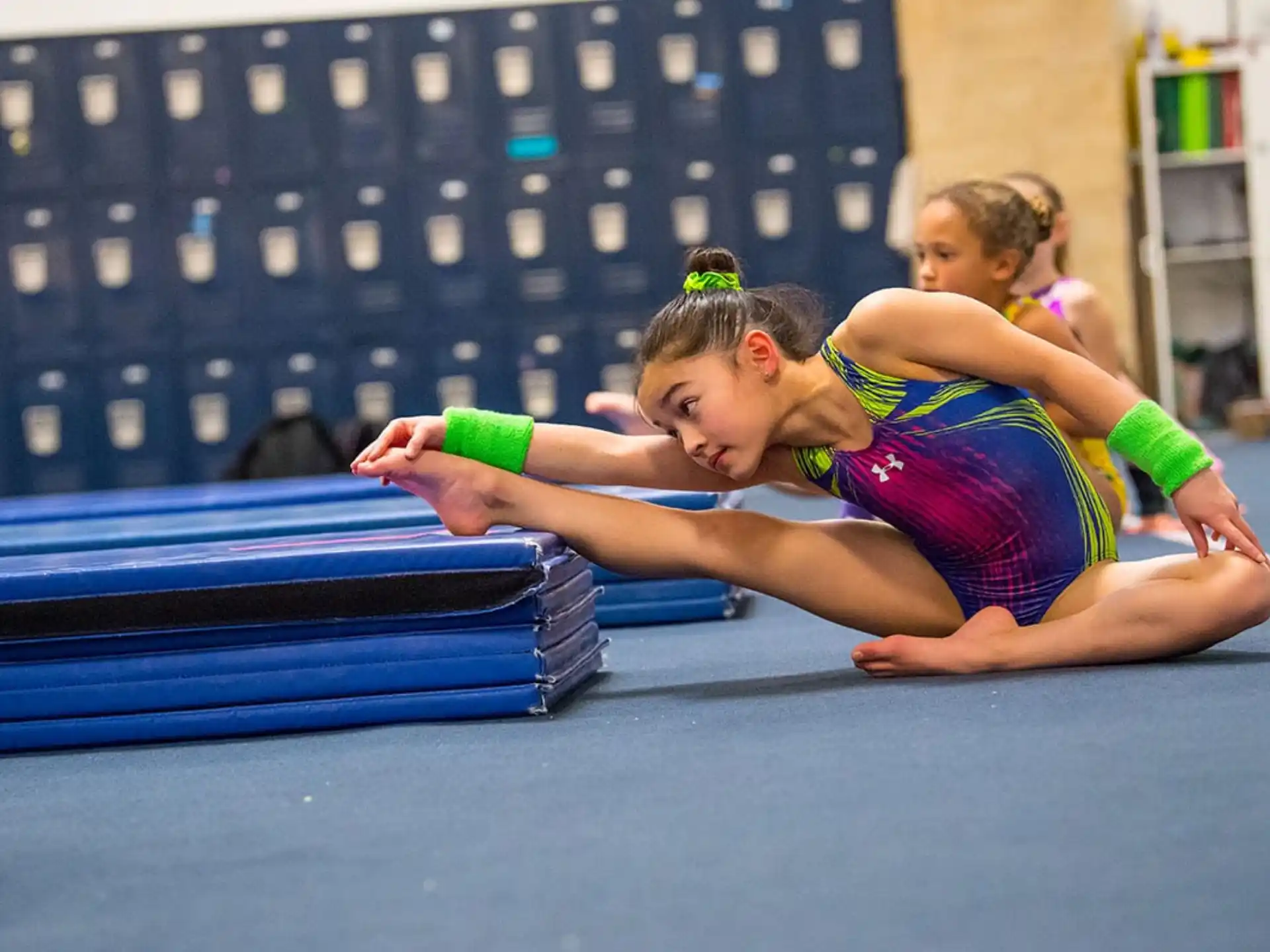 a couple of girls on a mat