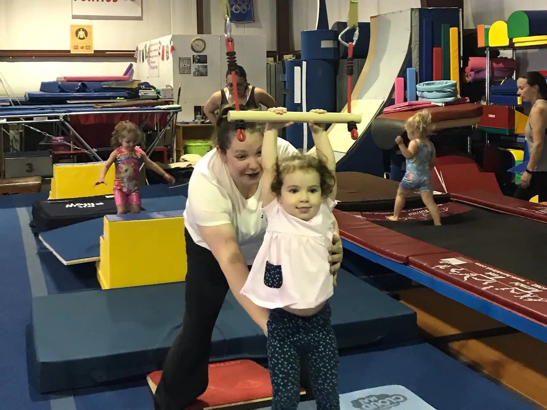 a person and a child posing for the camera