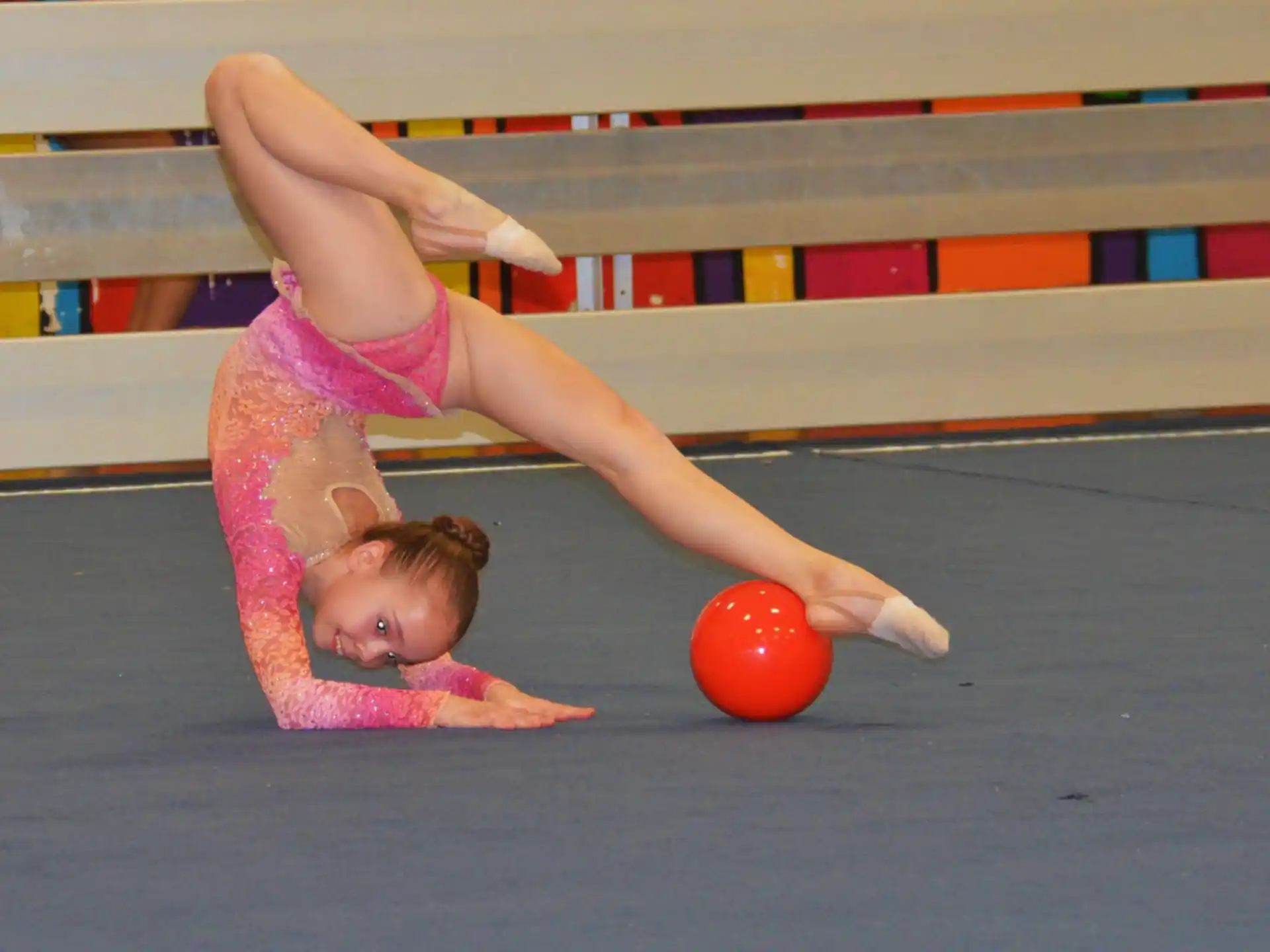 a person doing a handstand on a mat