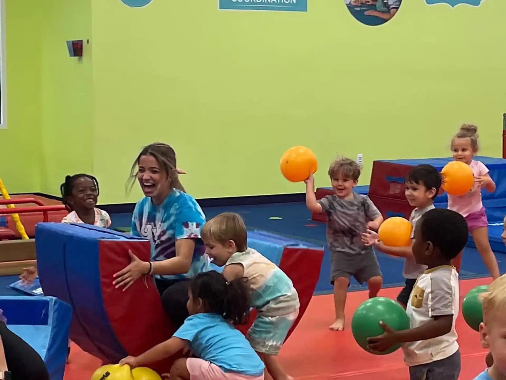 a group of children playing on a mat