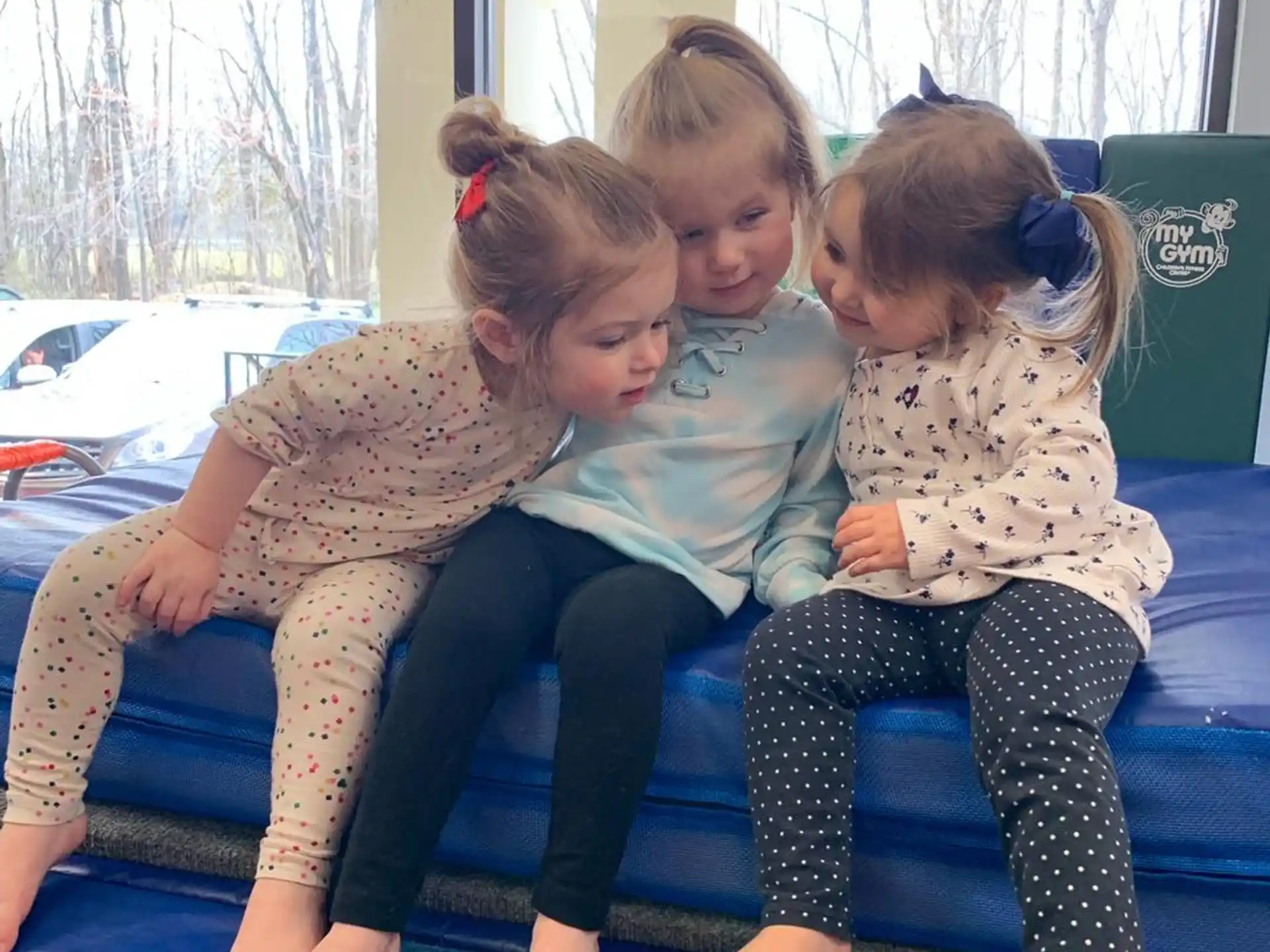 a group of children sitting on a couch